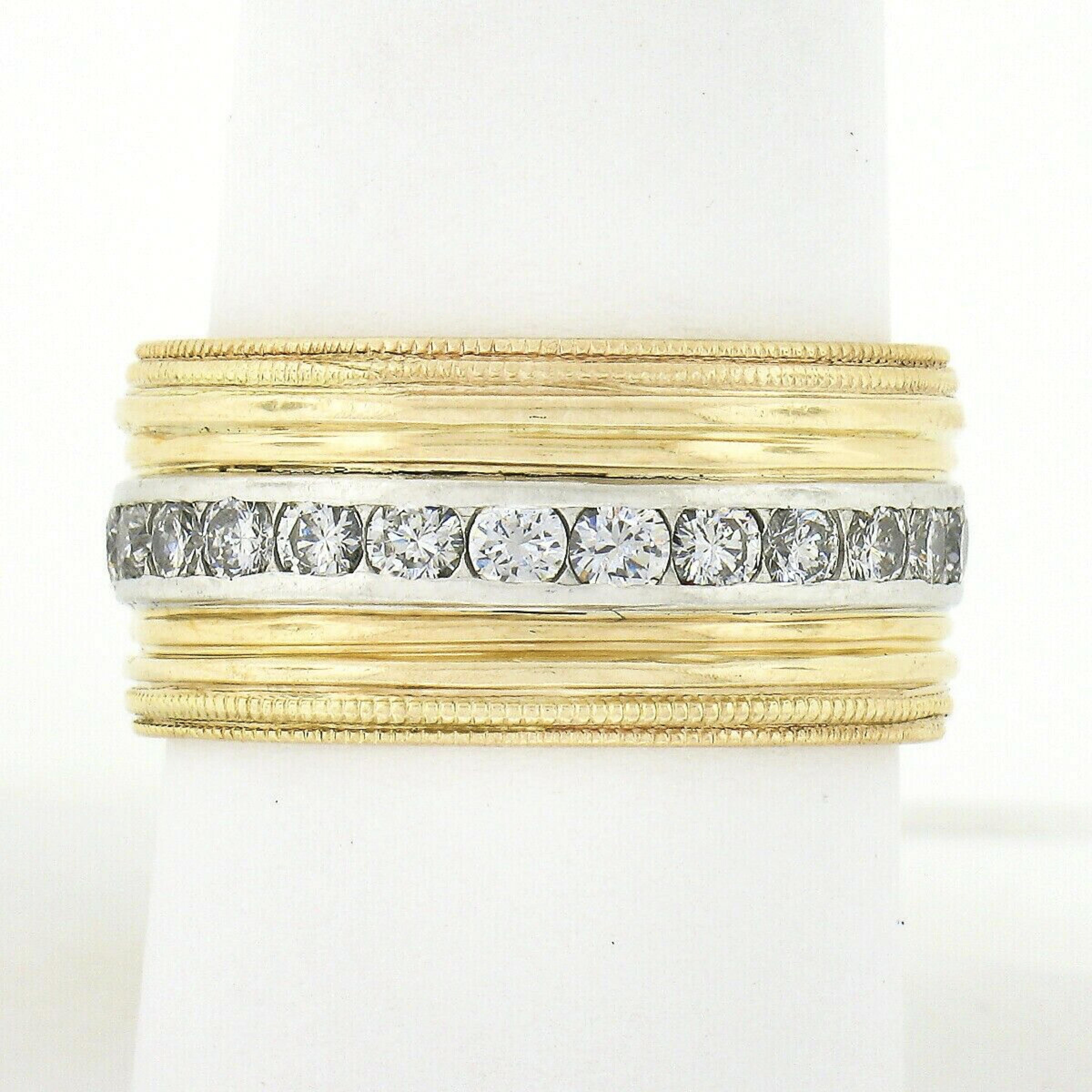 Here we have an absolutely gorgeous and wide vintage eternity band ring crafted from solid 14k yellow gold with a platinum center that carries 26 very fine quality diamonds entirely around the band. These stunning round brilliant diamonds total