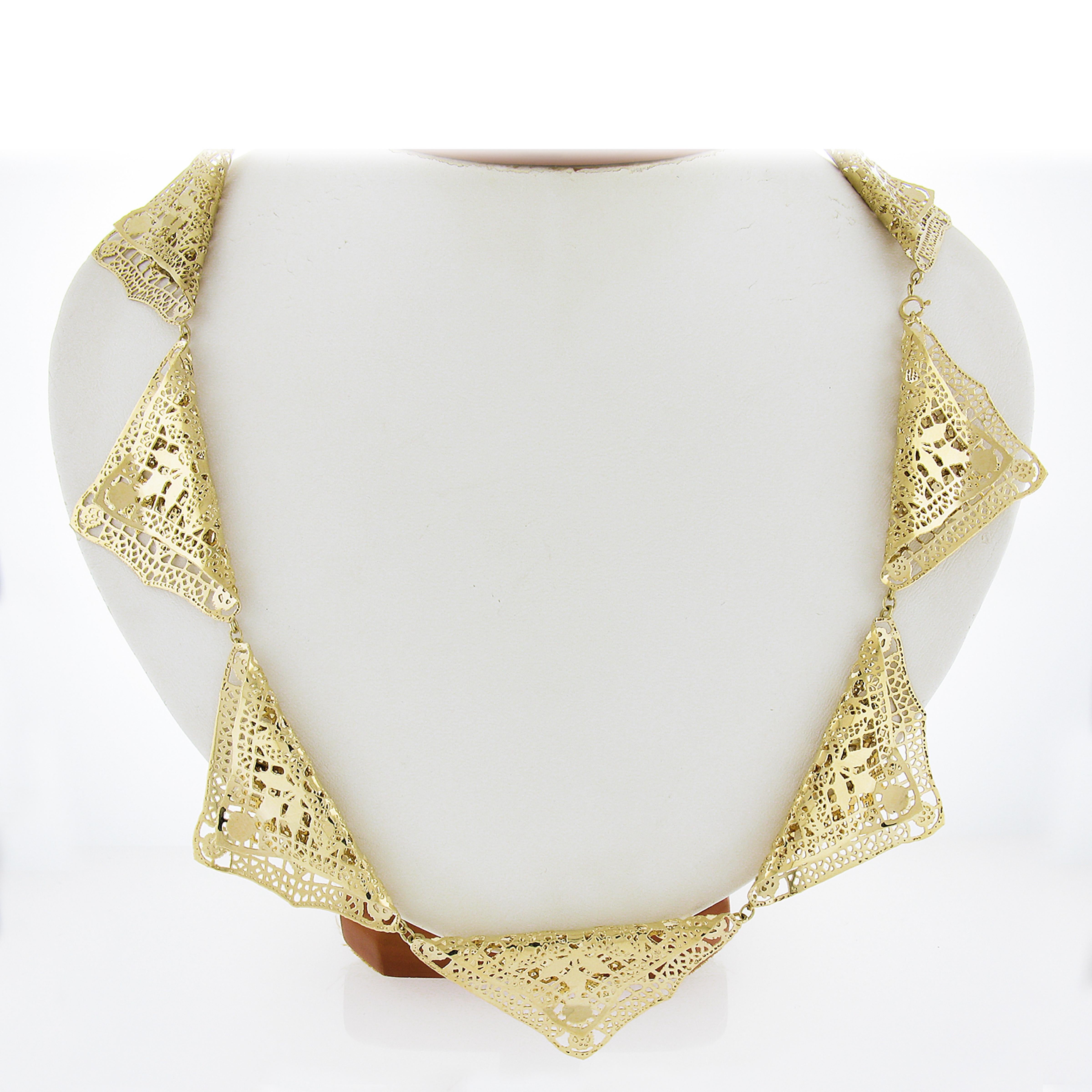 Very unusual folded open work lace like gold work in a triangular shape all the way around creating a unique necklace! High polished finish - this necklace is ready to take any outfit to the next level! Enjoy!

Material: Solid 14k Yellow