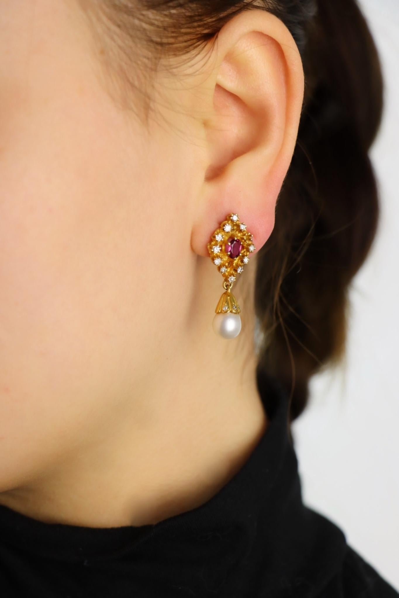 Vintage 14k Gold Ruby Diamonds Pearl Earrings

Marked:
14K

Approximate Dimensions:
3.2 cm (Length) 
1.3 cm (Width)
0.50 carat (Ruby)
0.72 carat (Diamonds)
7.94 - 8.02 mm (Pearl)
10.6 grams in weight.