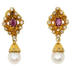 Ohrringe aus 14 Karat Gold mit Rubin, Diamanten und Perlen