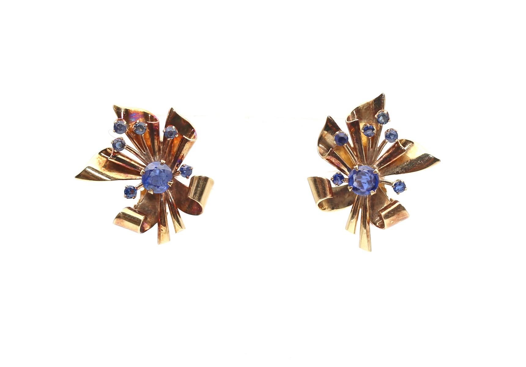 Vintage 14K Gold Sapphire Flower Earrings Marked, 1950

A Pair of Retro 14K Gold and Sapphire Earrings 14 Karats Yellow Gold. Designed as a flower with a round cut Sapphire in the middle and accented by tiny Sapphires. Marked.

These wonderfully