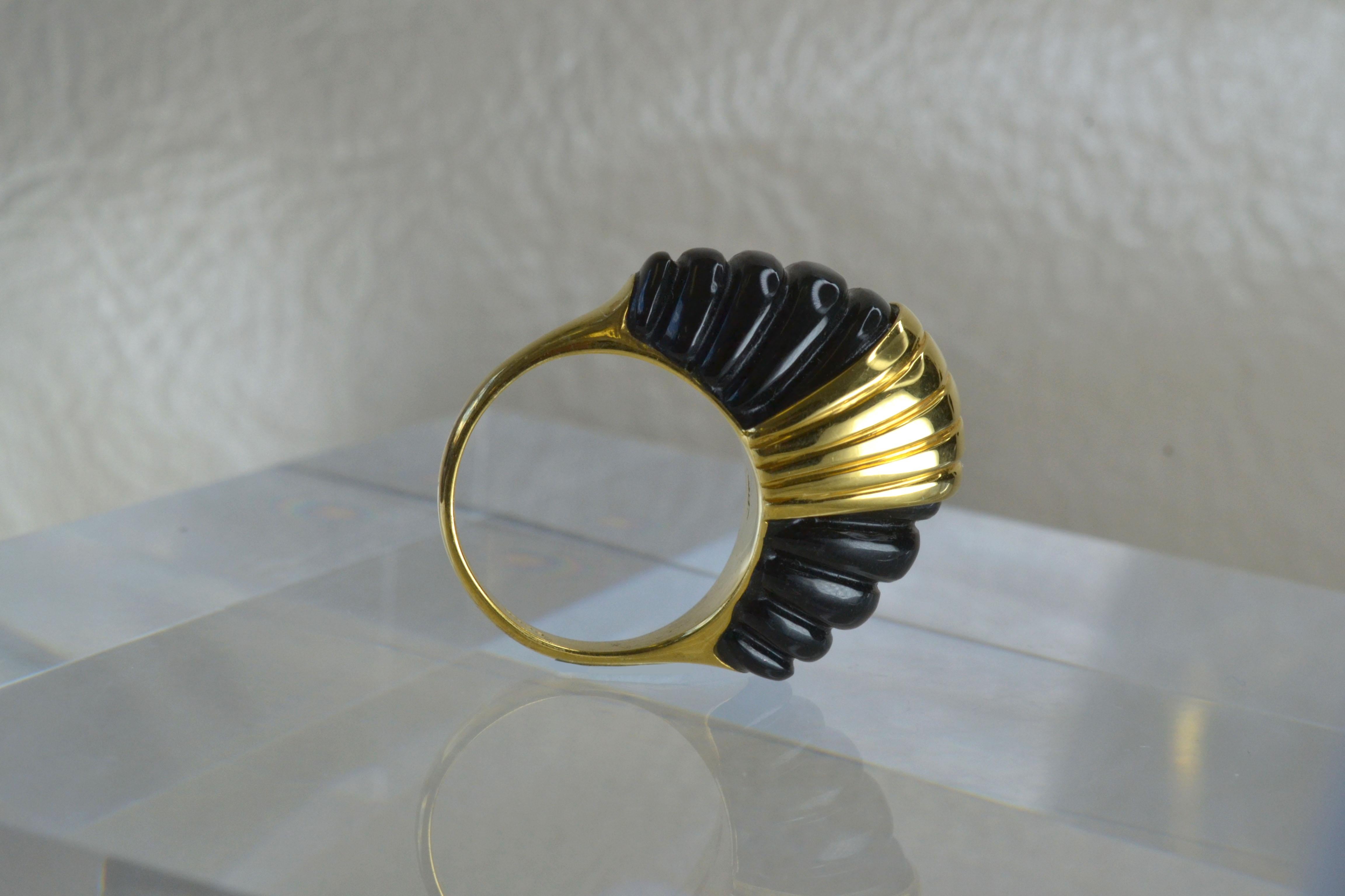 Vintage 14k Gold Scalloped Onyx Ring One-of-a-kind

This vintage, scalloped onyx and 14k gold ring would look perfect with any outfit. Made in the 1980s, it comfortably fits a size O 1/2 finger!

Vintage from the 1980s 
Size: O 1/2 UK/AU 
Materials: