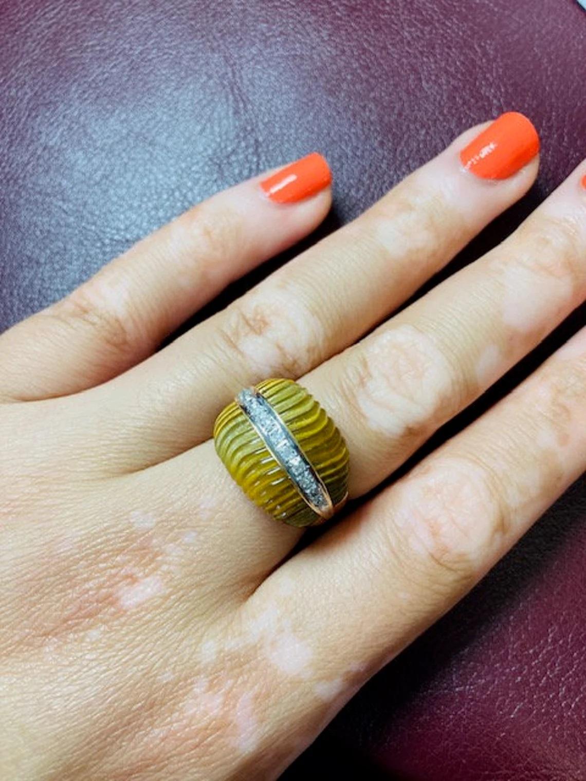 Vintage 14k Gold Tiger's Eye Scalloped Ring One-of-a-kind

This vintage ring from the 1980s is a perfect statement piece. It has scalloped tiger's eye beautifully complimented by a trail of dazzling white diamonds. Made to size N finger
