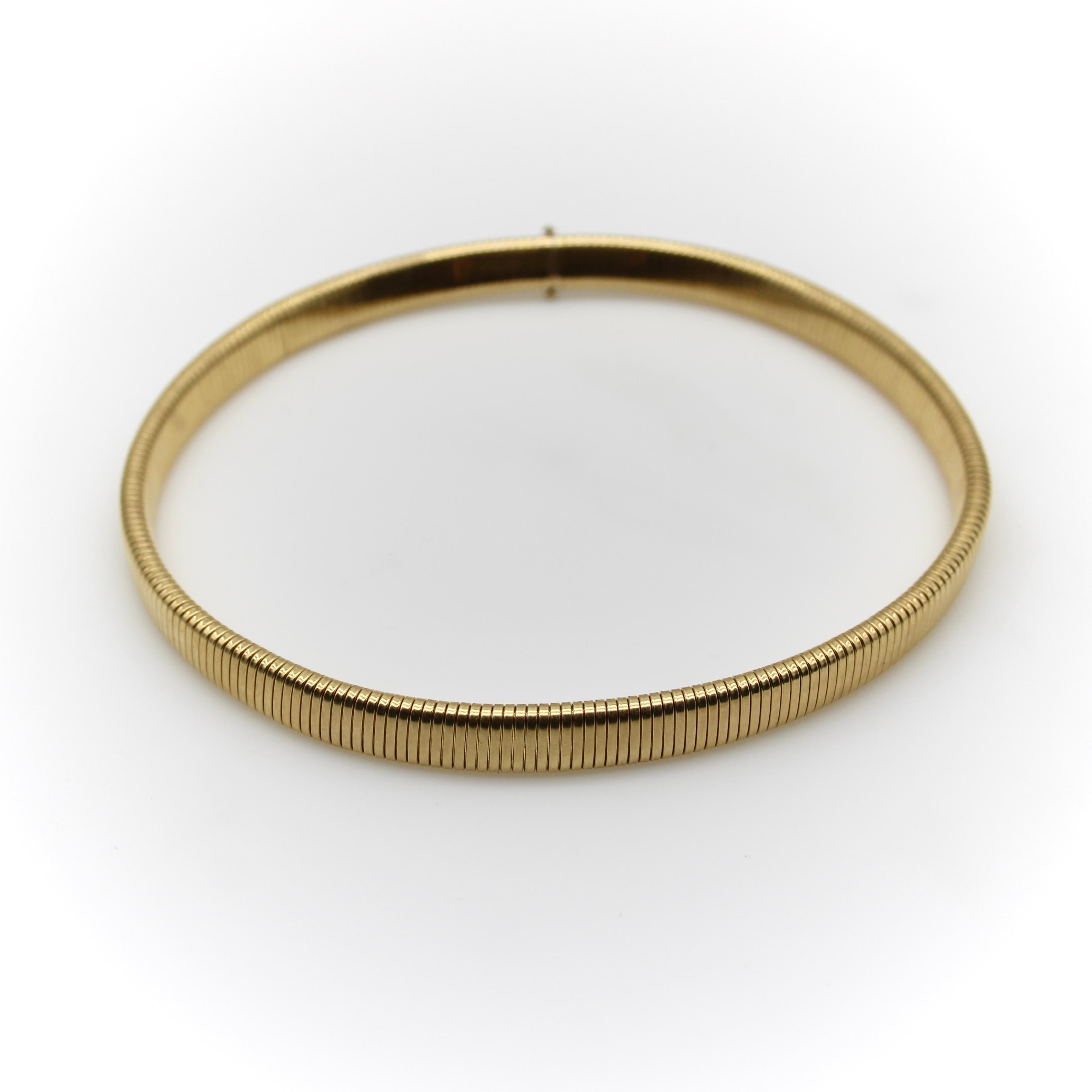 Circa the 1970’s, this 14k gold necklace is a revival of a World War II era  jewelry making technique called tubogas. A hollow, flexible tube consisting of interlocking gold links makes for a fun and interesting necklace with a springlike quality