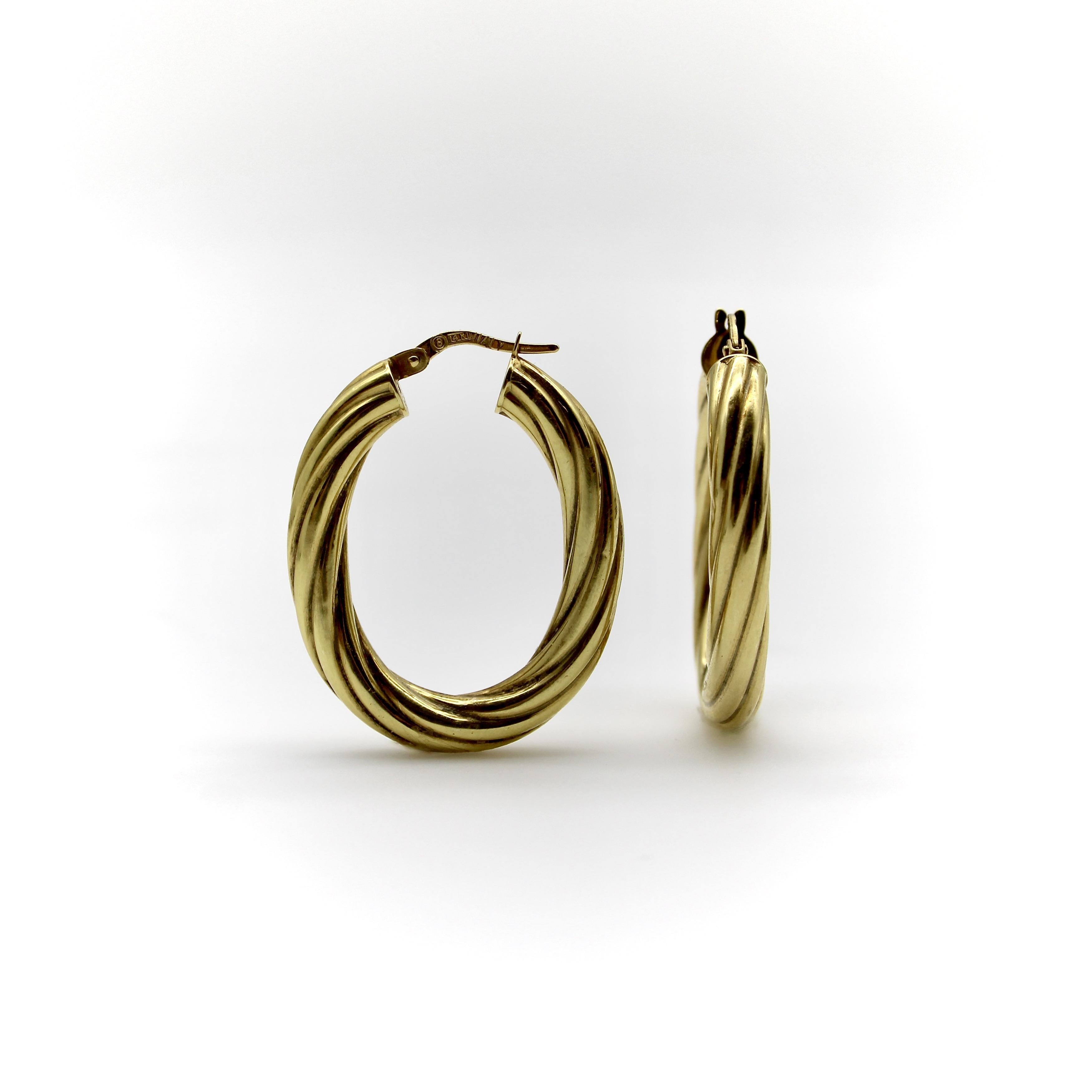 These 14k gold vintage hoops are a great pair of everyday earrings. The larger size of the hoops gives these earrings a great visual presence, while their hollow-construction allows them to remain lightweight. These make for a sophisticated staple