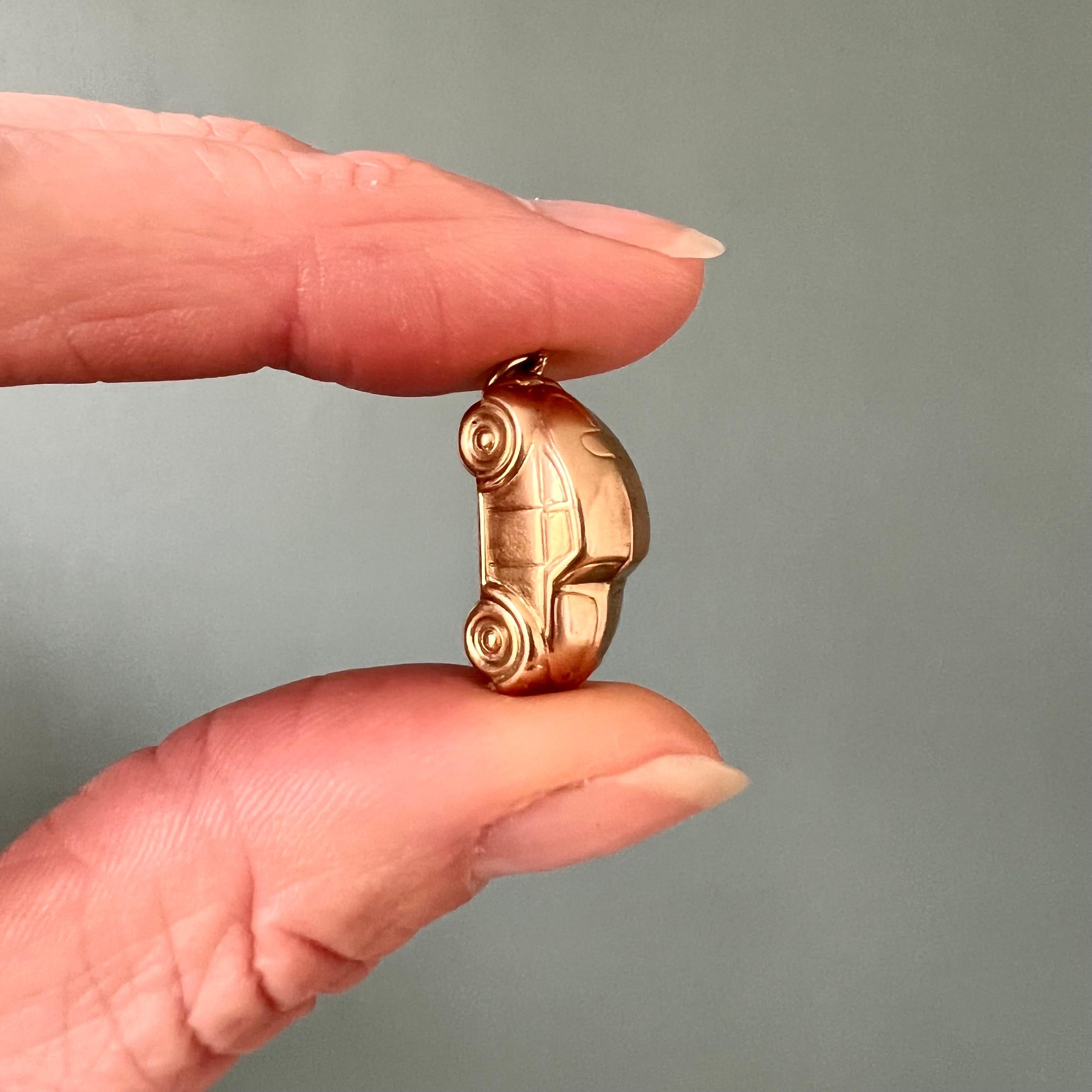 A lovely vintage 14 karat gold Volkswagen Beetle charm pendant. The charm is nicely modeled into a beetle bug wagen which were very popular during the 60's and 70's of the twentieth century. The Volkswagen Beetle is one of the most instantly