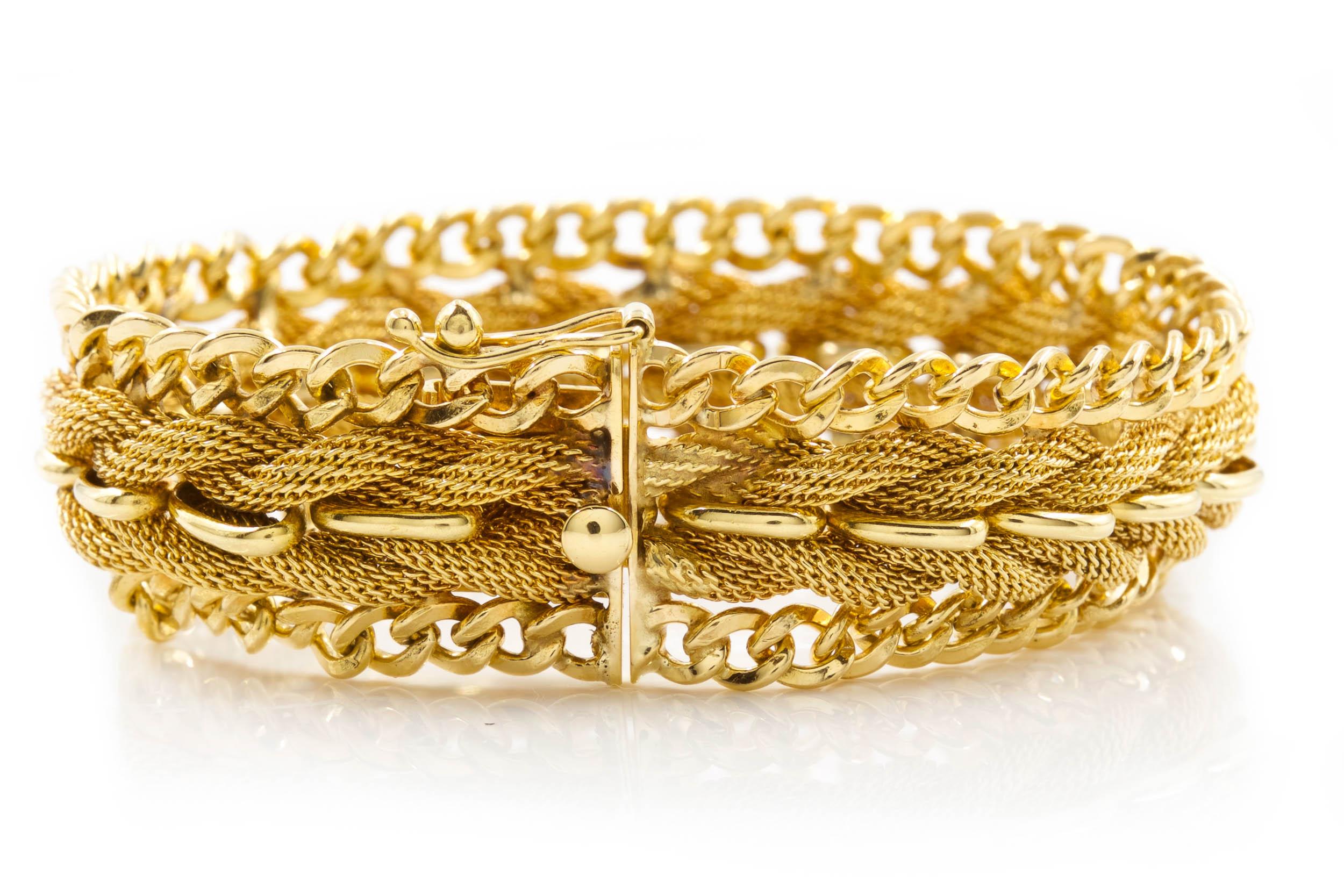 A very fun flexible-link bracelet executed entirely in 14 karat yellow gold by the goldsmith Aladdin Gold Creations of Illinois circa 1990. The bracelet is a rather creative mixture of outer chain links soldered to an inner woven mesh that is then