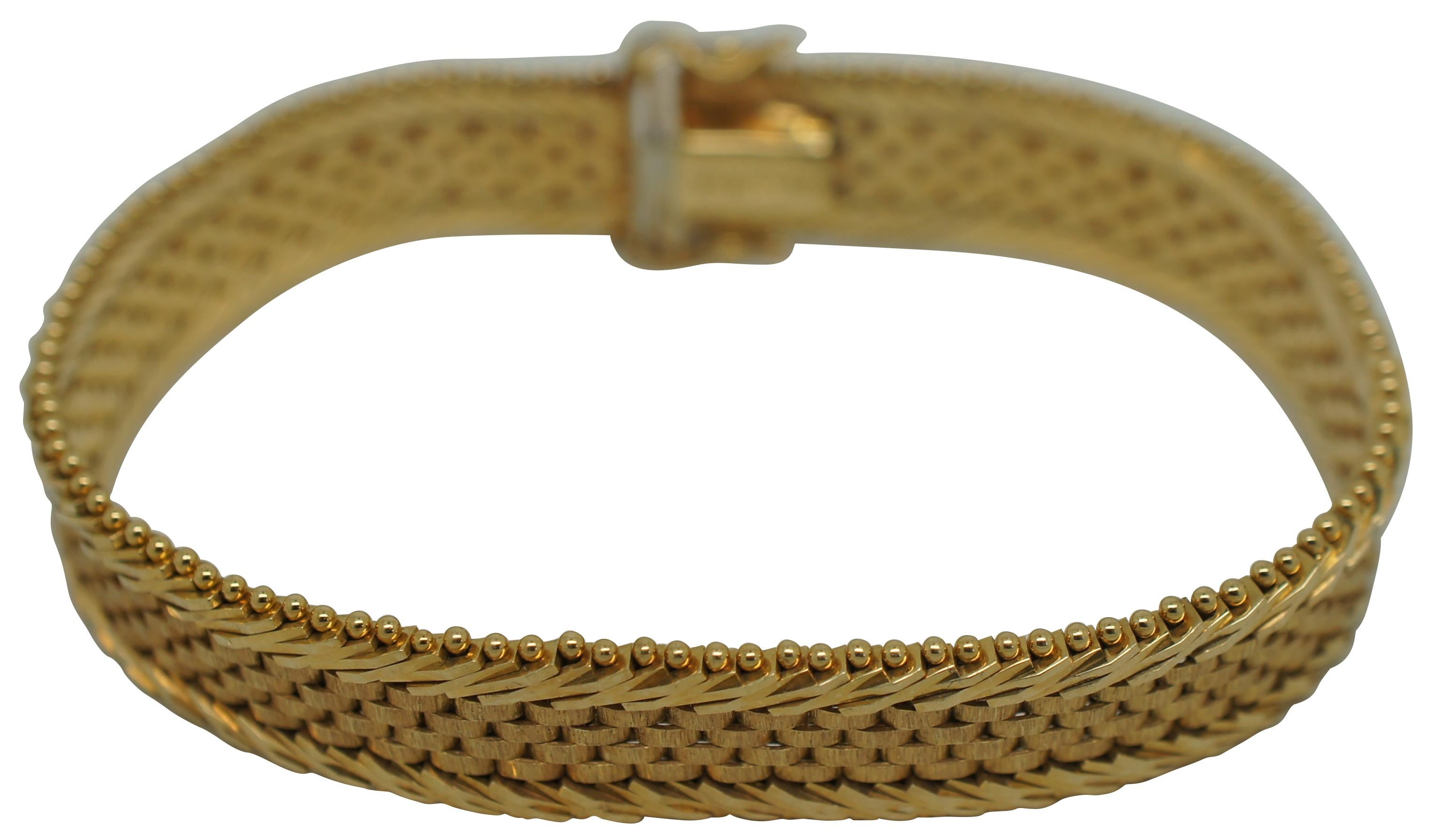 Vintage 14k yellow gold flat 9.5mm wide chain bracelet featuring a panther chain center framed with a split herringbone and beaded border. Open box clasp. Marked 14k Imperial Gold USA.

7” x 0.375” (Length x Width) / 24.6 g