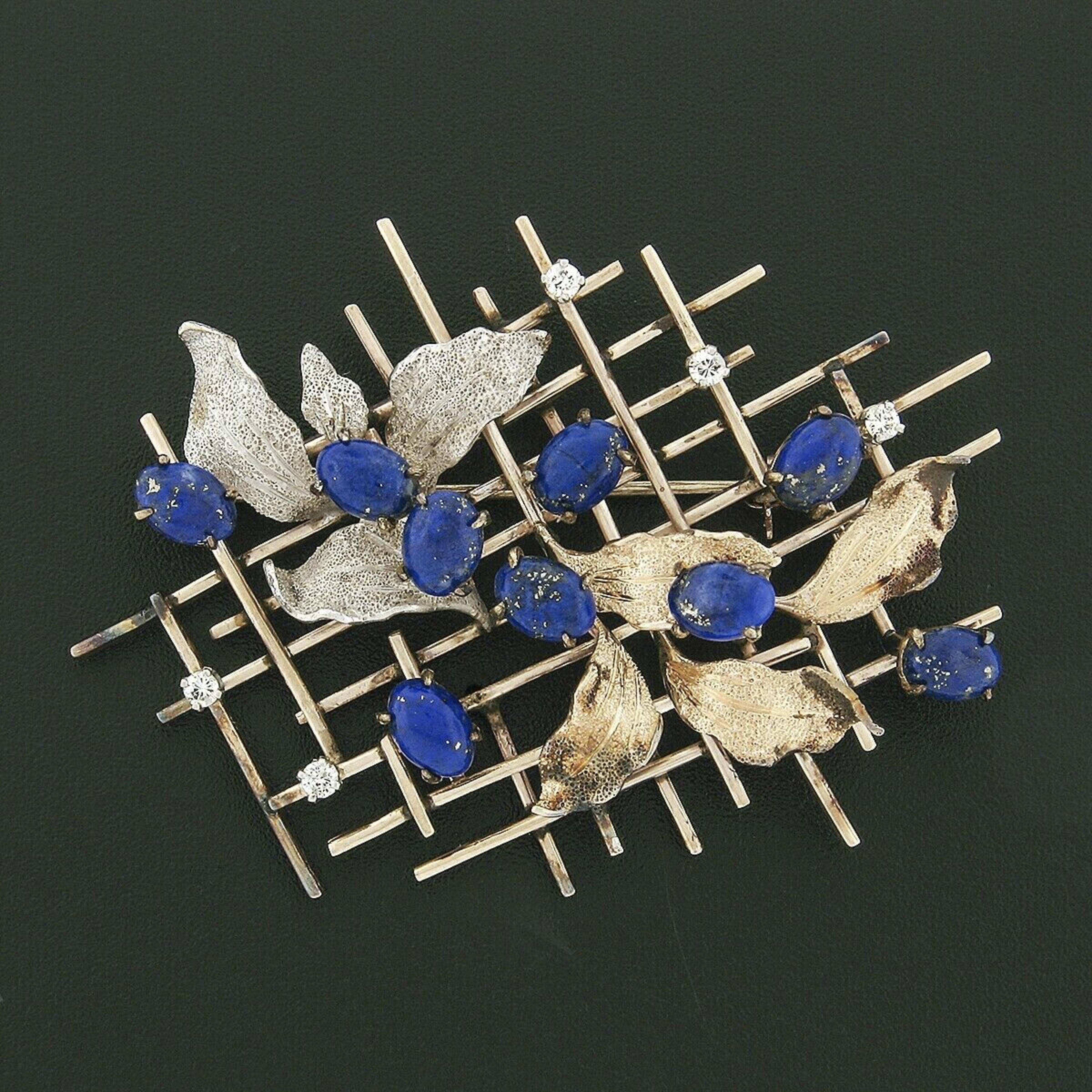 This unique and large vintage brooch/pin is well crafted in solid 14k yellow, white, and rose gold featuring lapis and diamonds on an open grid design with textured leaves throughout. The leaves and the blue lapis stones are placed throughout the