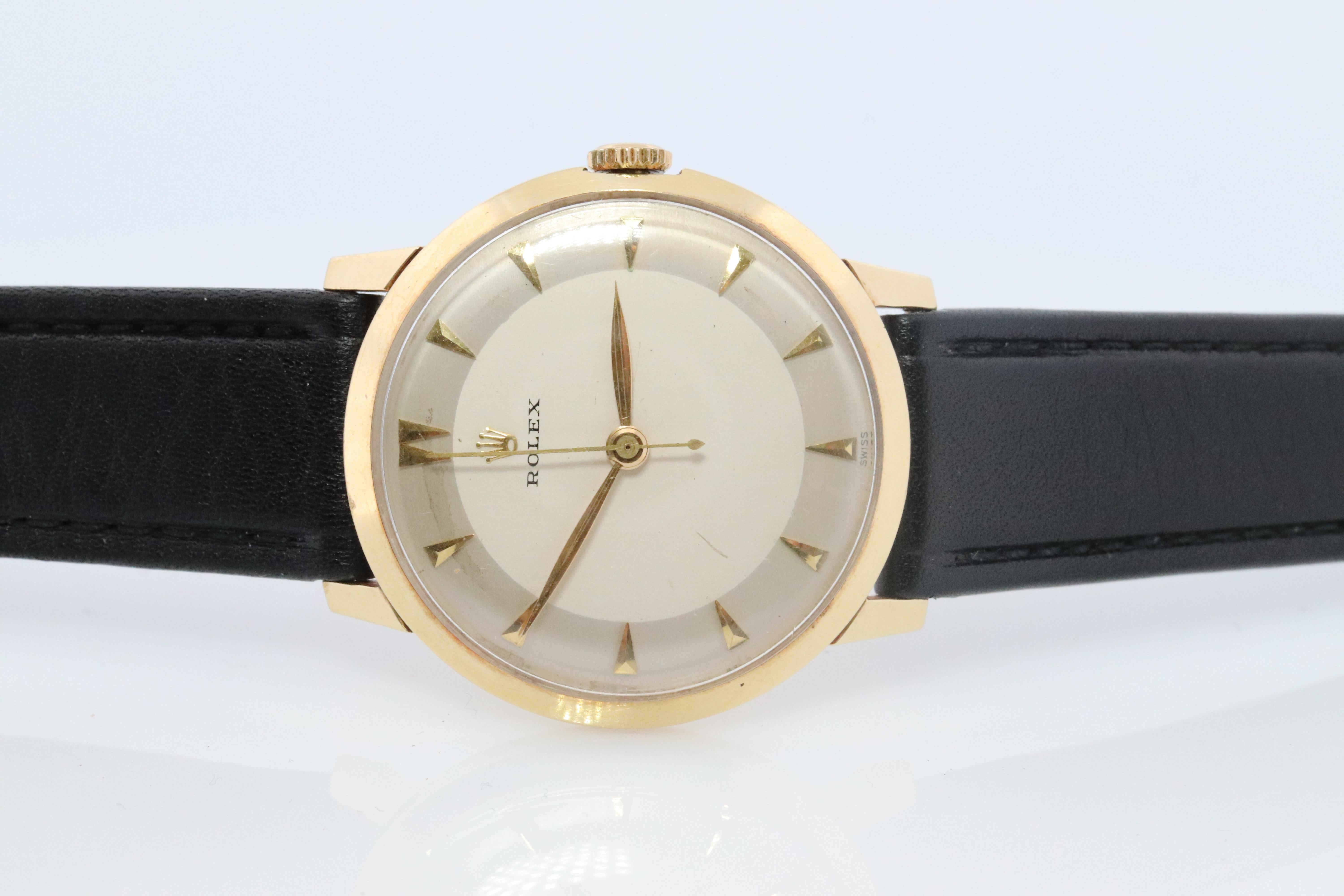 Vintage 1950s Rolex  Mens Watch

14k Yellow Gold Case

Windup Movement. Runs well.
1215 Movement 
17Jewel

Circa 1950s

Beautiful Watch.

New Genuine Gucci Leather band.

34mm round Case