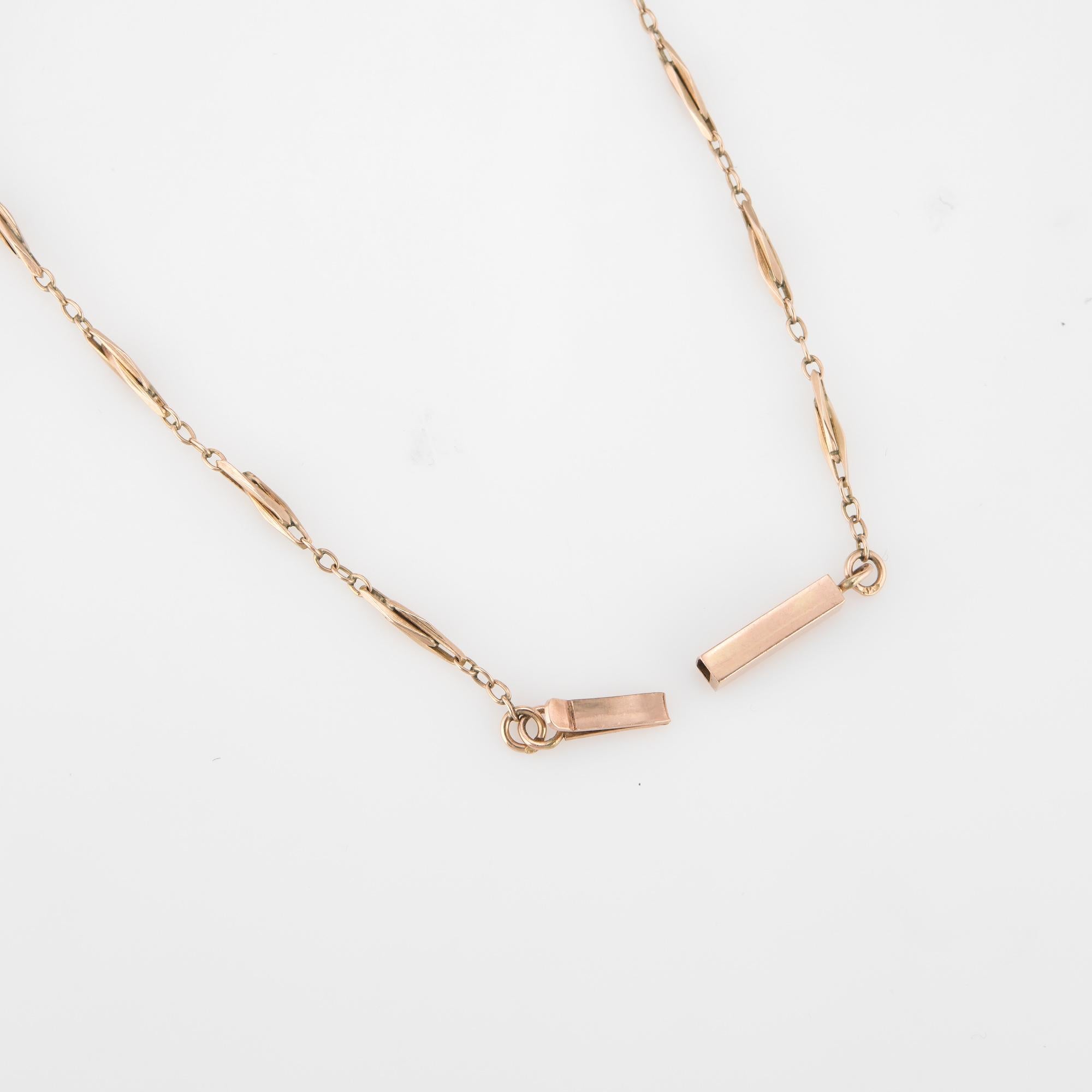 Elegant and finely detailed vintage necklace (circa 1940s to 1950s) crafted in 14 karat rose gold.  

The necklace measures 25 inches in length and sits nicely below the nape of the necklace. The interlocking links are further supported with two
