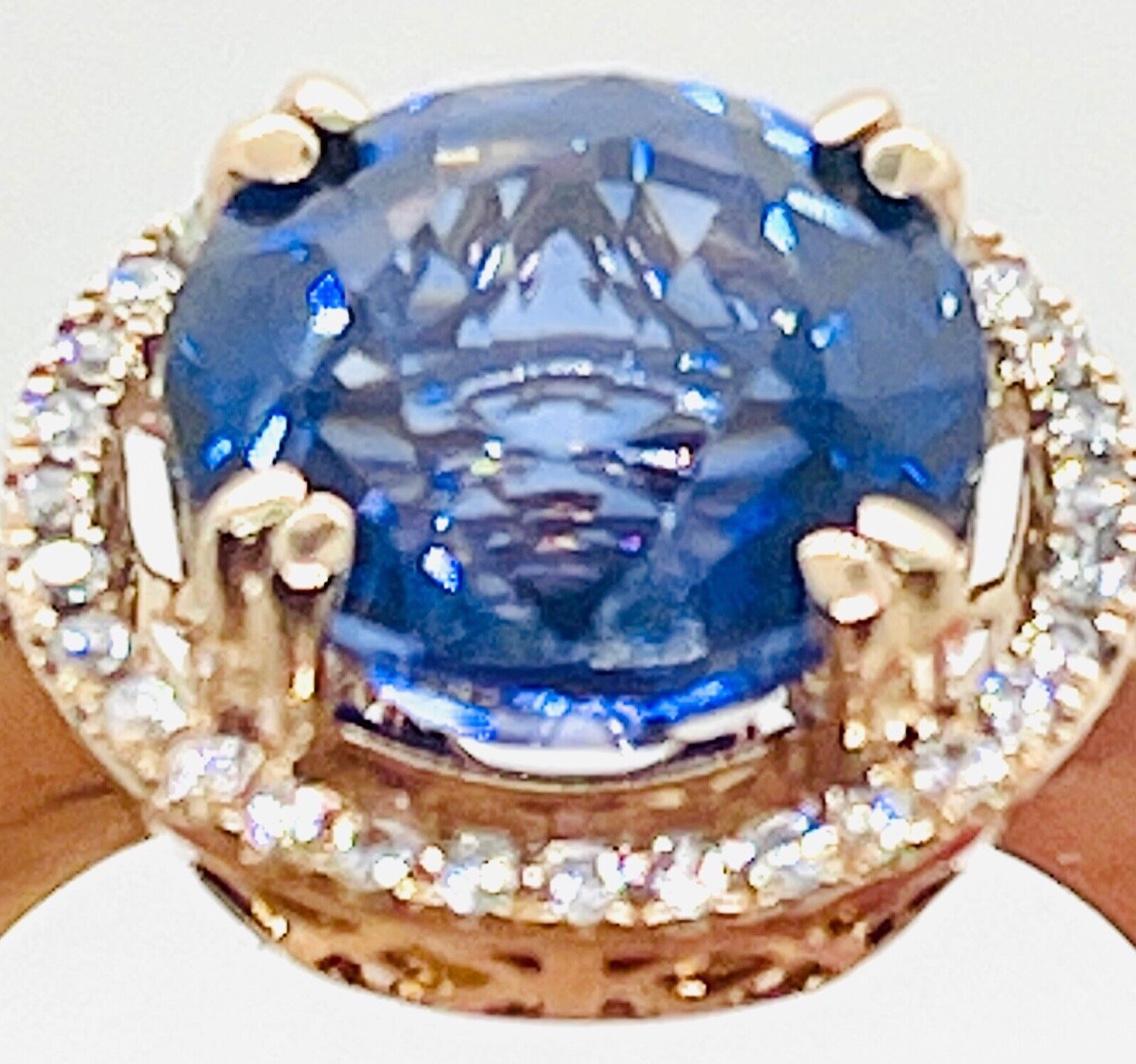 Vintage 14K Rose Gold Genuine Natural Cornflower Blue Sapphire (5.76 ct.) & Diamond (.29 ctw.) Halo Cocktail Ring

Appraised for $10,000 in 2020

4.7 g

Free Next Day Overnight (Express) Shipping (Fully Insured, Signature will be Required)

Free