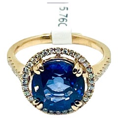 Bague de fiançailles vintage en or rose 14 carats avec saphir bleu en forme de tournesol et halo de diamants