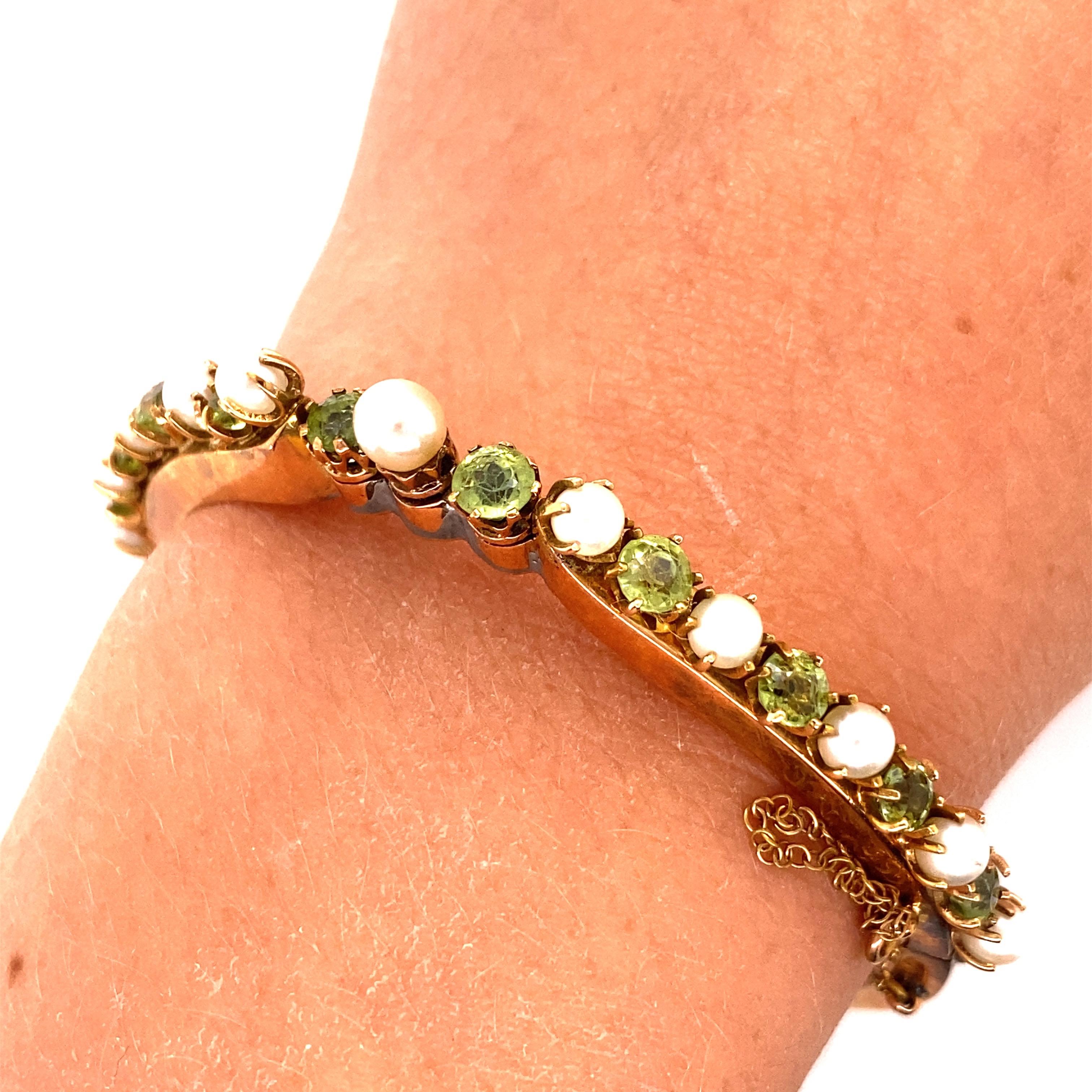 Vintage 14K Rose Gold Pearl and Peridot Bangle Bracelet - The bracelet contains 11 4mm pearls and 10 3.5 - 4mm peridots. The bracelets width is 4.9mm on the top and tapers to 3.4mm on the bottom. The inside diameter is 2 inches high and 2 inches