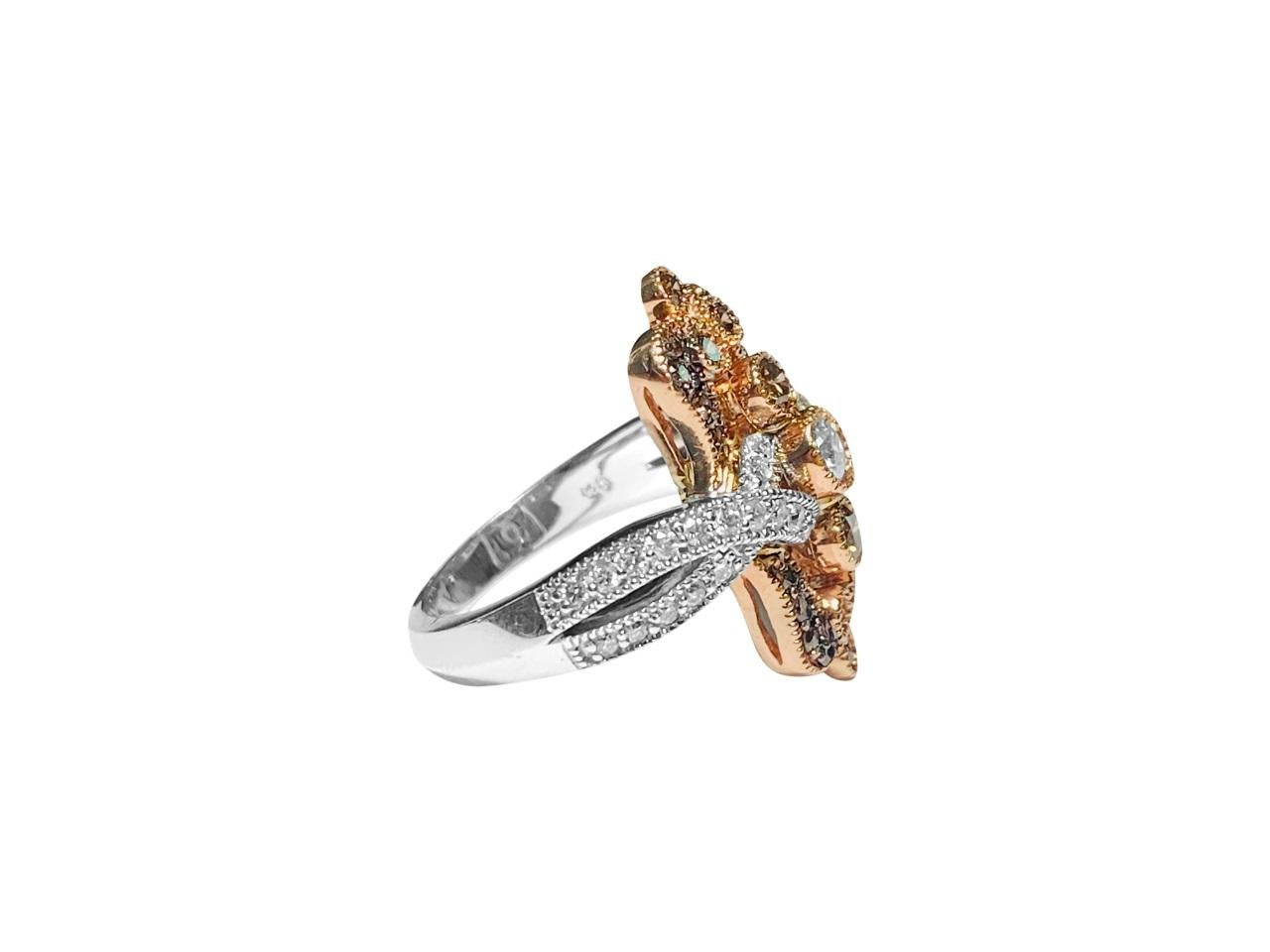 Embrace timeless elegance with this exquisite ladies' vintage ring crafted from 14k rose gold, adorned with a captivating combination of fancy chocolate and white diamonds. The white diamonds, boasting SI2 clarity and G color, are complemented by