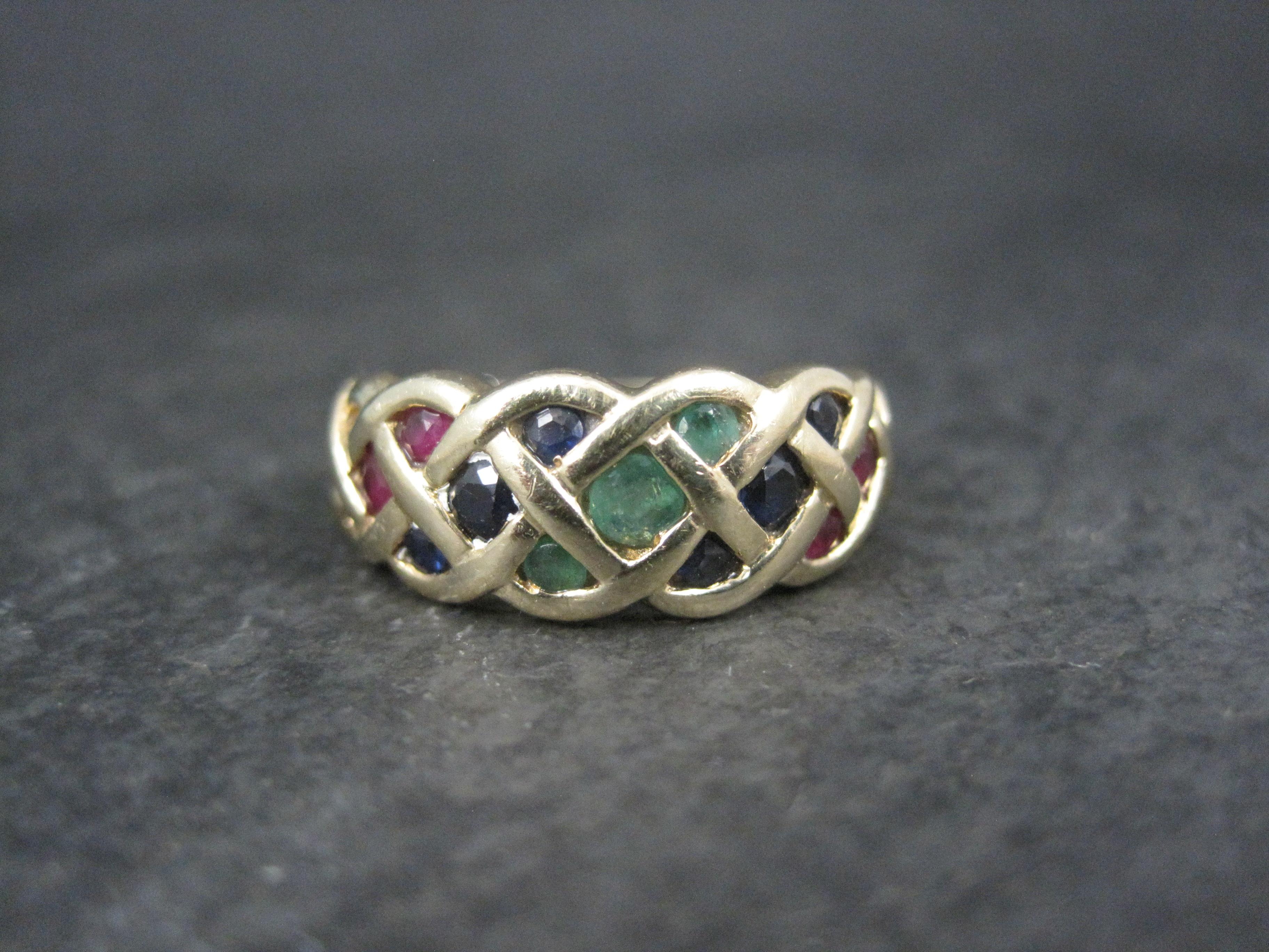This beautiful estate ring is 14k yellow gold with sapphires, rubies and emerald gemstones.

The face of this ring measures 5/16 of an inch north to south.
Size: 7

Marks: 14K

Condition: Excellent