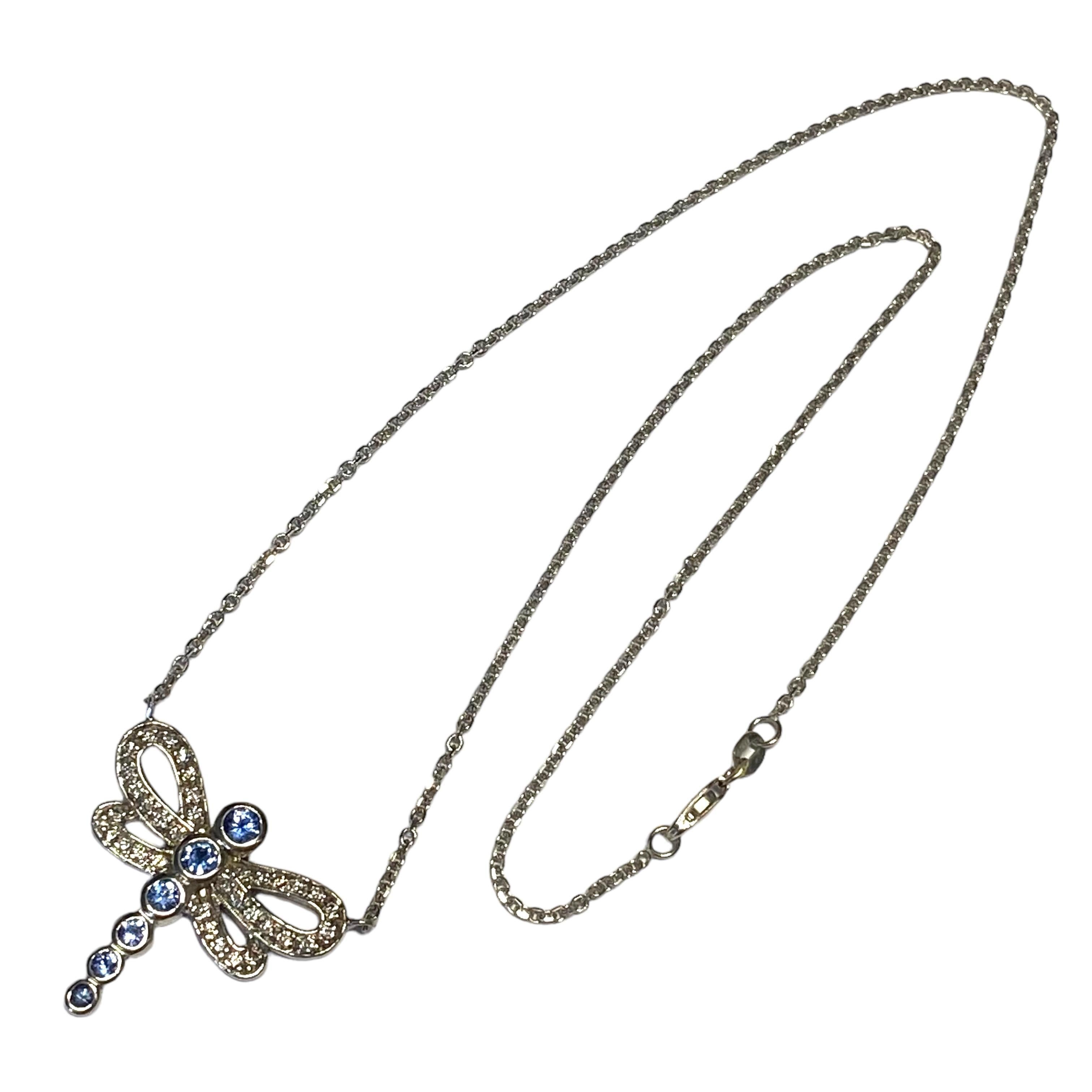 Crafted in 14K white gold, the necklace features a dragonfly with graduating bezel set round sapphire and diamond set wings, supported by a rolo chain with lobster claw clasp.
6 Sapphire: approx. 0.65ctw
35 round brilliant cut diamonds: approx.