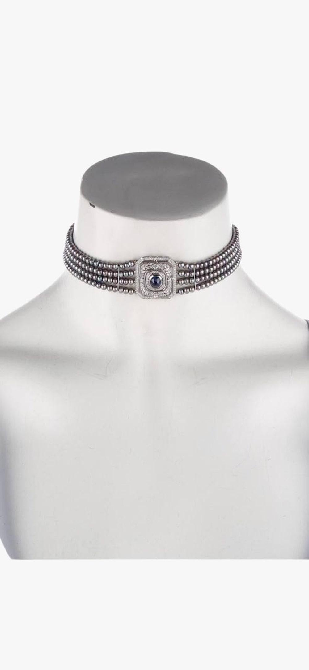 Vintage multistrand 14K White Gold necklace made of grey dyed cultured pearls and diamonds set centered with a sapphire cabochon. 
Gemstone: Diamond
Carat Weight: 0.93
Stone Count: 114
Stone Shape: Round