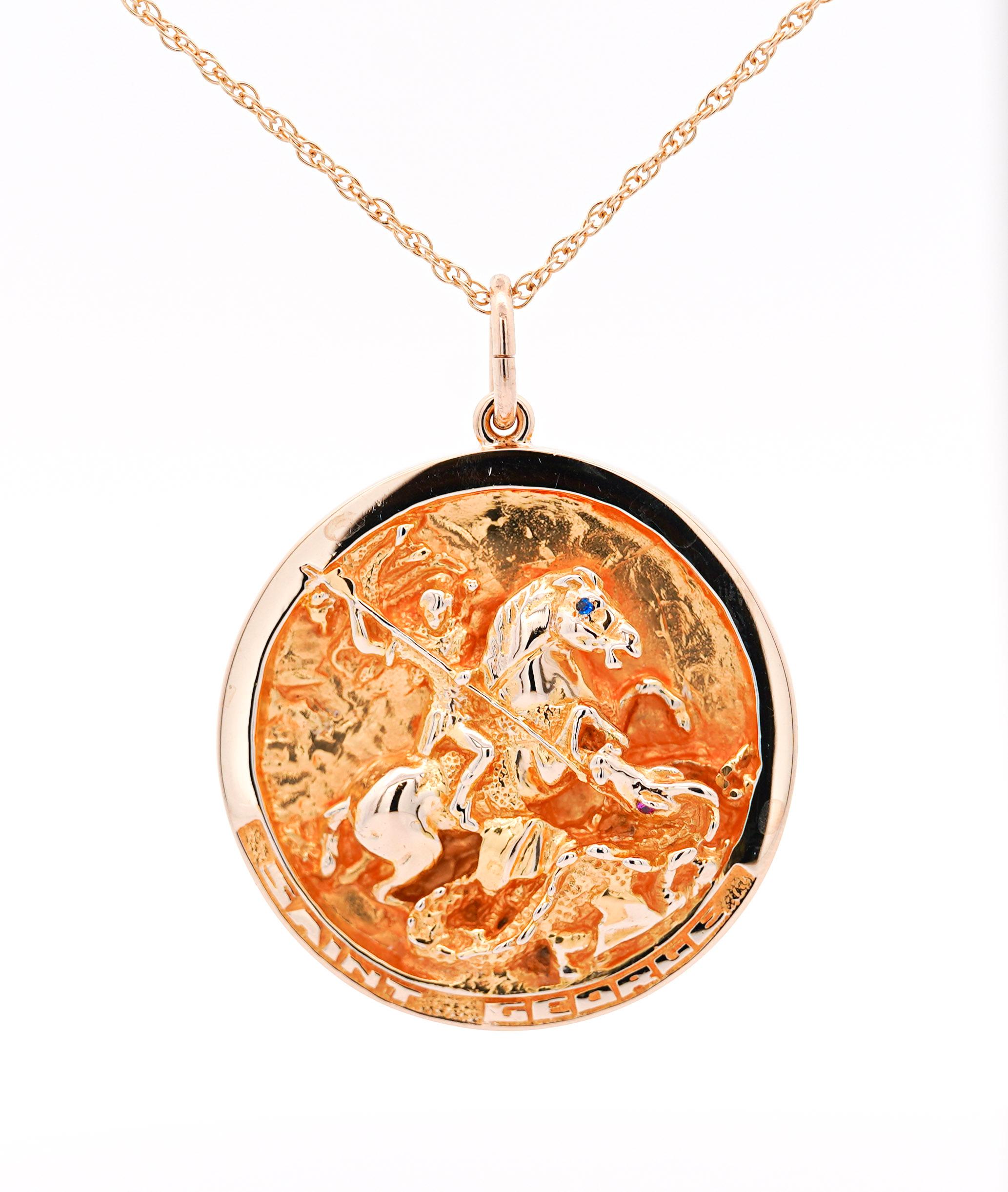 William Ruser signed 14k solid yellow gold medallion pendants. order comes as a set of three. Each having its own distinct carving. Saint George and Our Lady Of Fatima have a round cut blue sapphire set of eyes.

Featuring Saint George Slaying