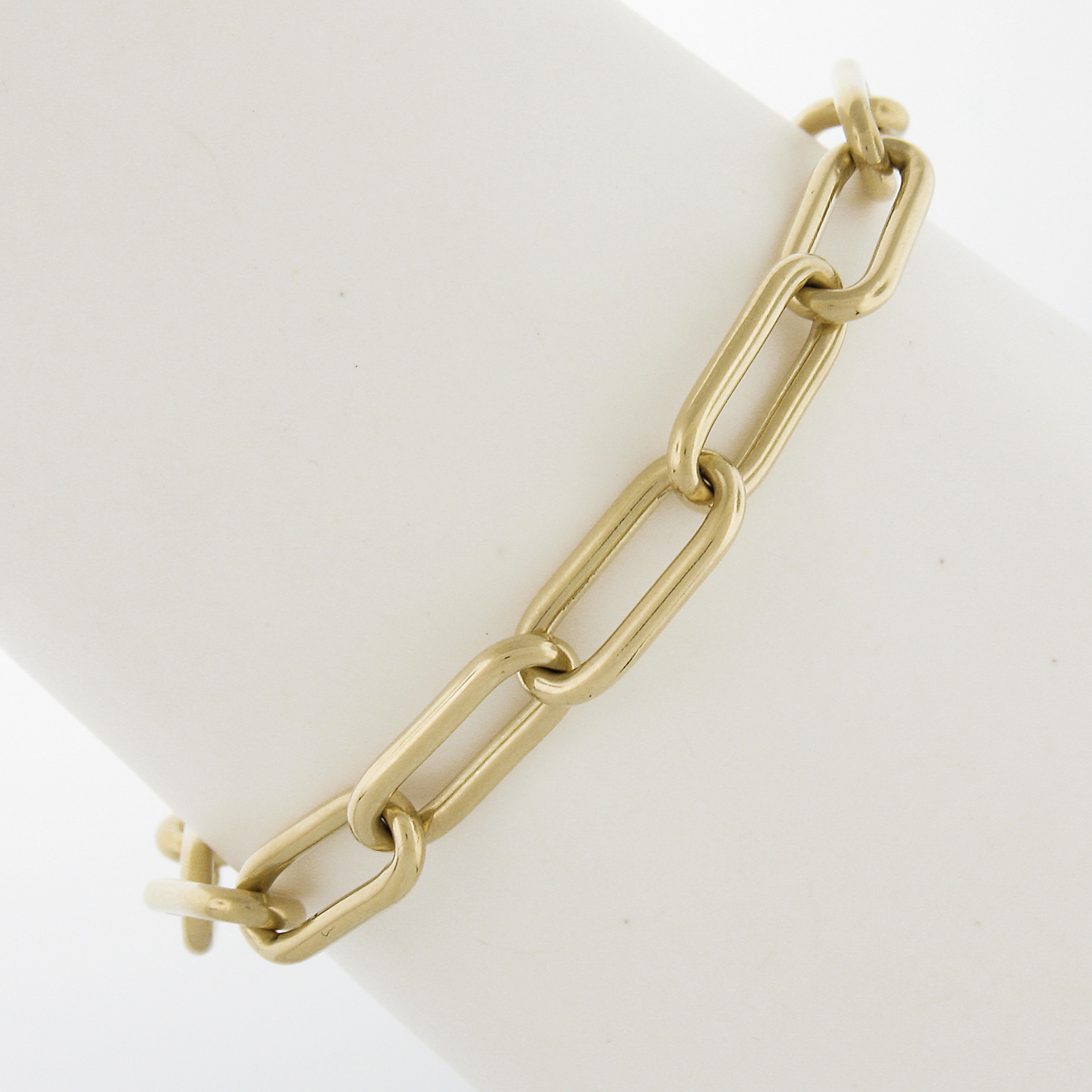 Material: 14k Solid Yellow Gold All - 18k Gold Safety Chain
Weight: 19.86 Grams
Chain Type: Oval Open Link , Paper Clip Like
Chain Length: Will Comfortably Fit a 6.75