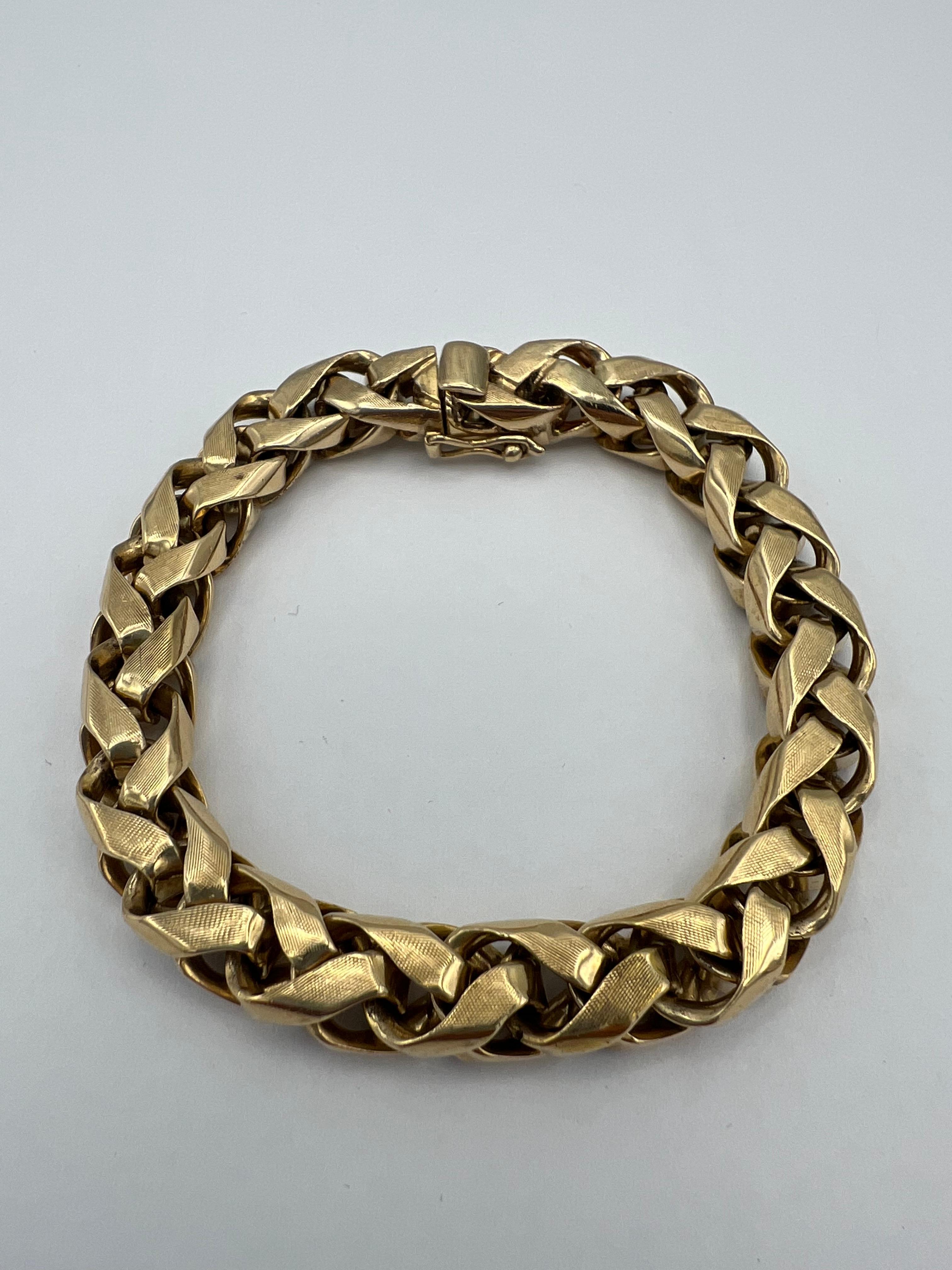 DESIGNER: Tiffany & Co.
CIRCA: 1970’s
MATERIALS: 14k Yellow Gold
WEIGHT: 75.4 grams
MEASUREMENTS: 7.5” x 5/16”
HALLMARKS: Tiffany, 14k
ITEM DETAILS:
​A vintage 14k gold Tiffany&Co. braided bracelet

​This gorgeous bracelet is made of the gold