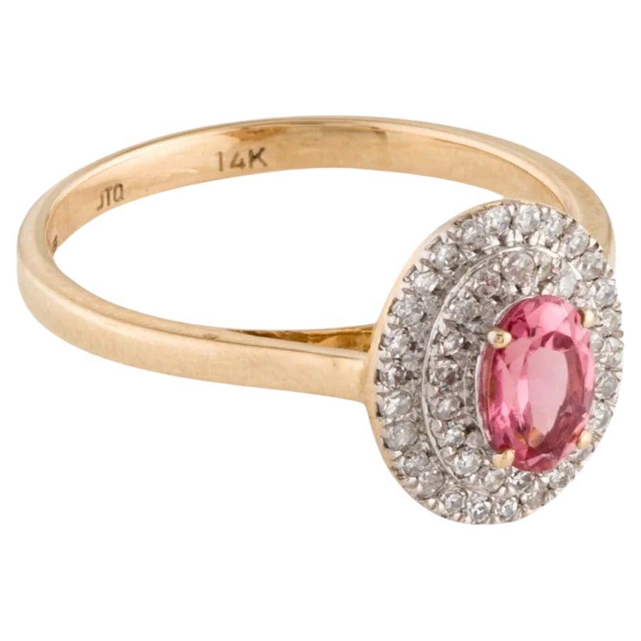 Elevate your style with this exquisite rhodium-plated and 14K yellow gold cocktail ring, adorned with a stunning 0.42 carat oval modified brilliant tourmaline at its center. Complemented by 44 sparkling single-cut diamonds totaling 0.24 carats, this