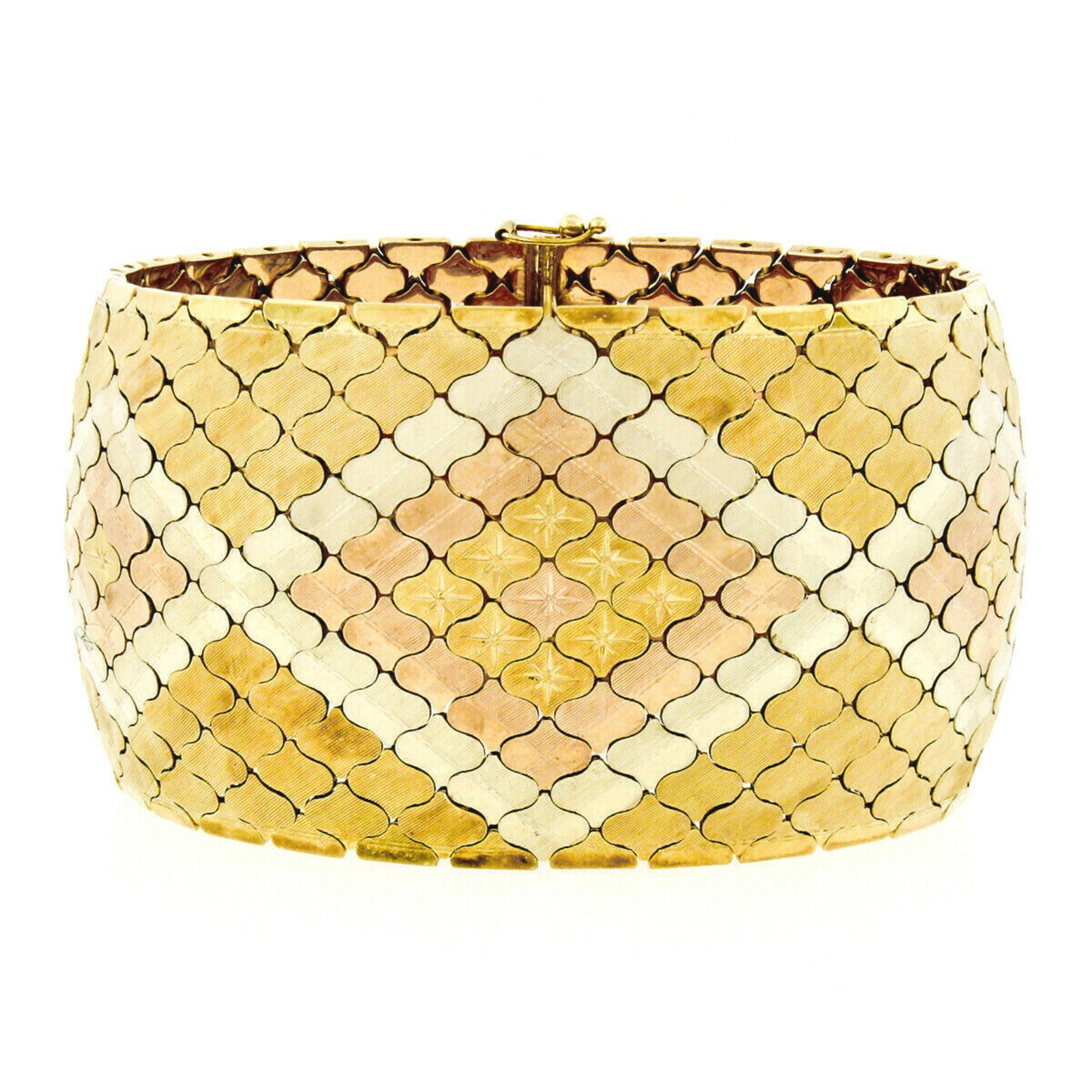 This gorgeous vintage bracelet was crafted in Italy from solid 14k yellow, white, and rose gold. It features a diamond pattern beautifully executed in tri-color gold mesh links. In addition to the differences in color there are also etched star