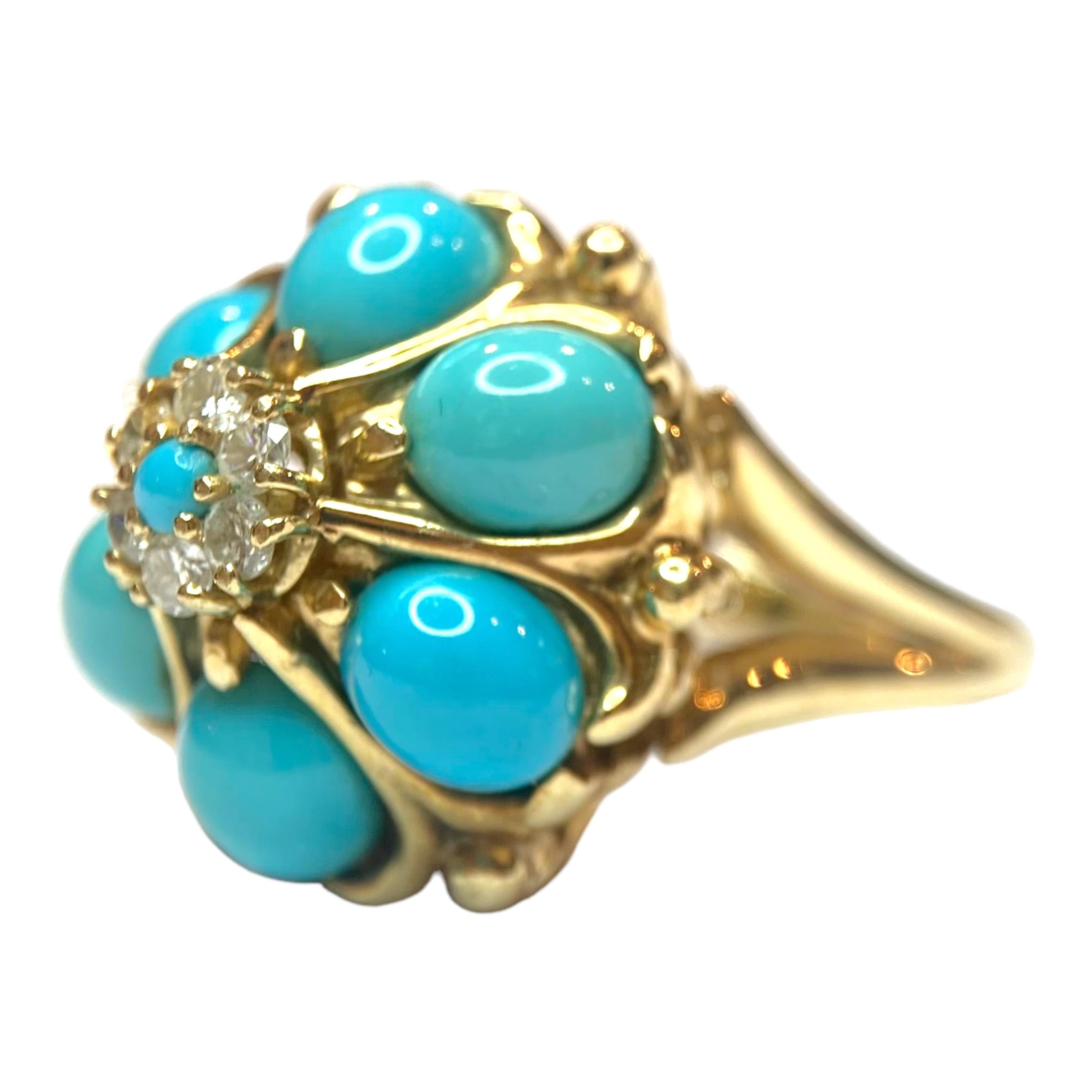Crafted in 14K yellow gold, the ring features a domed design of six oval natural turquoise cabochons surrounding a diamond and turquoise floret.
The oval turquoise cabochons measure an average of 7.5 mm x 6 mm. The small round center measures 2.5 mm