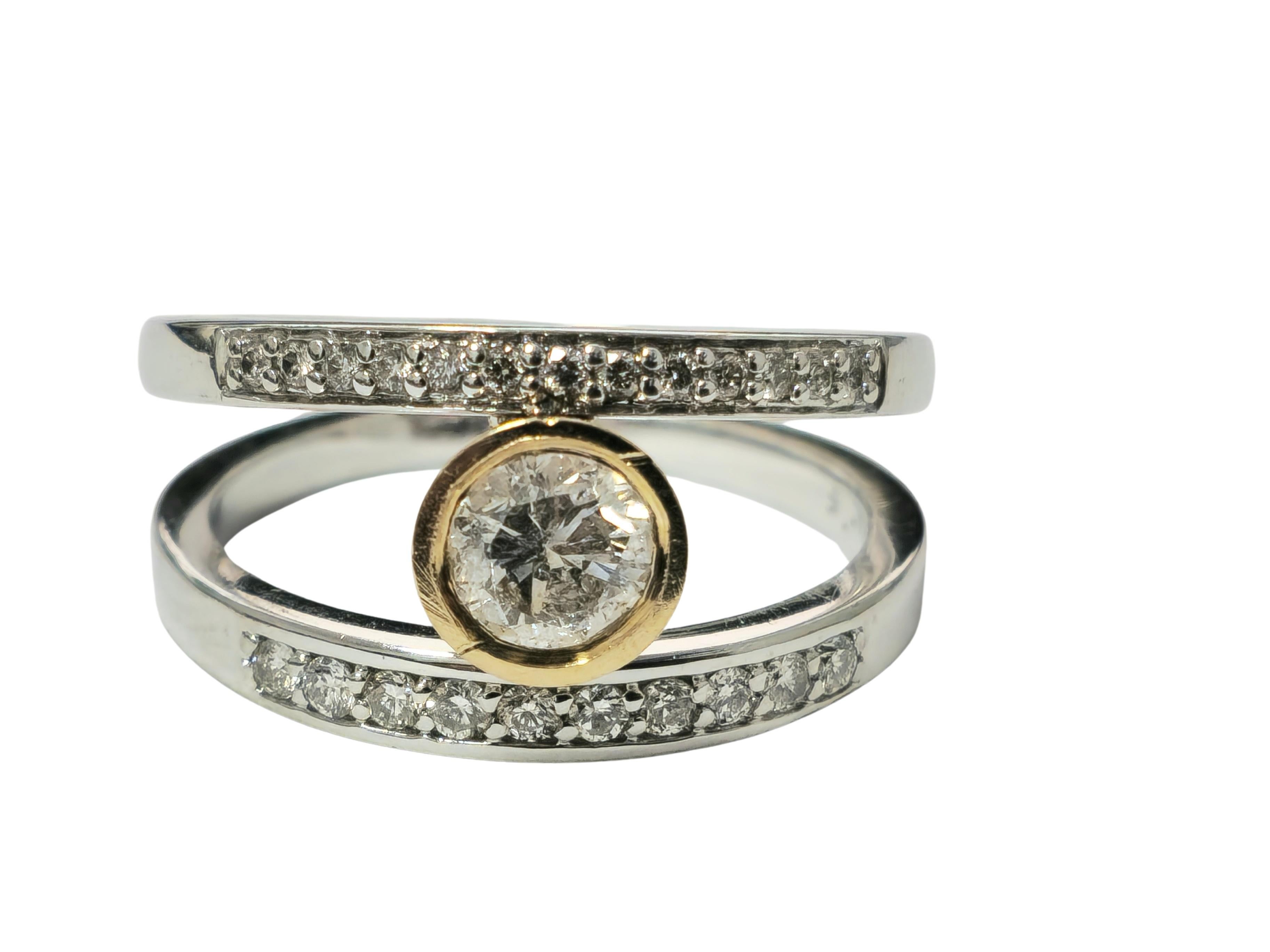 Experience timeless elegance with our Vintage Diamond and Gold Ring, meticulously crafted from luxurious 14k white and rose gold. Adorned with a captivating center diamond and side diamonds, each boasting exquisite clarity and color, this ring