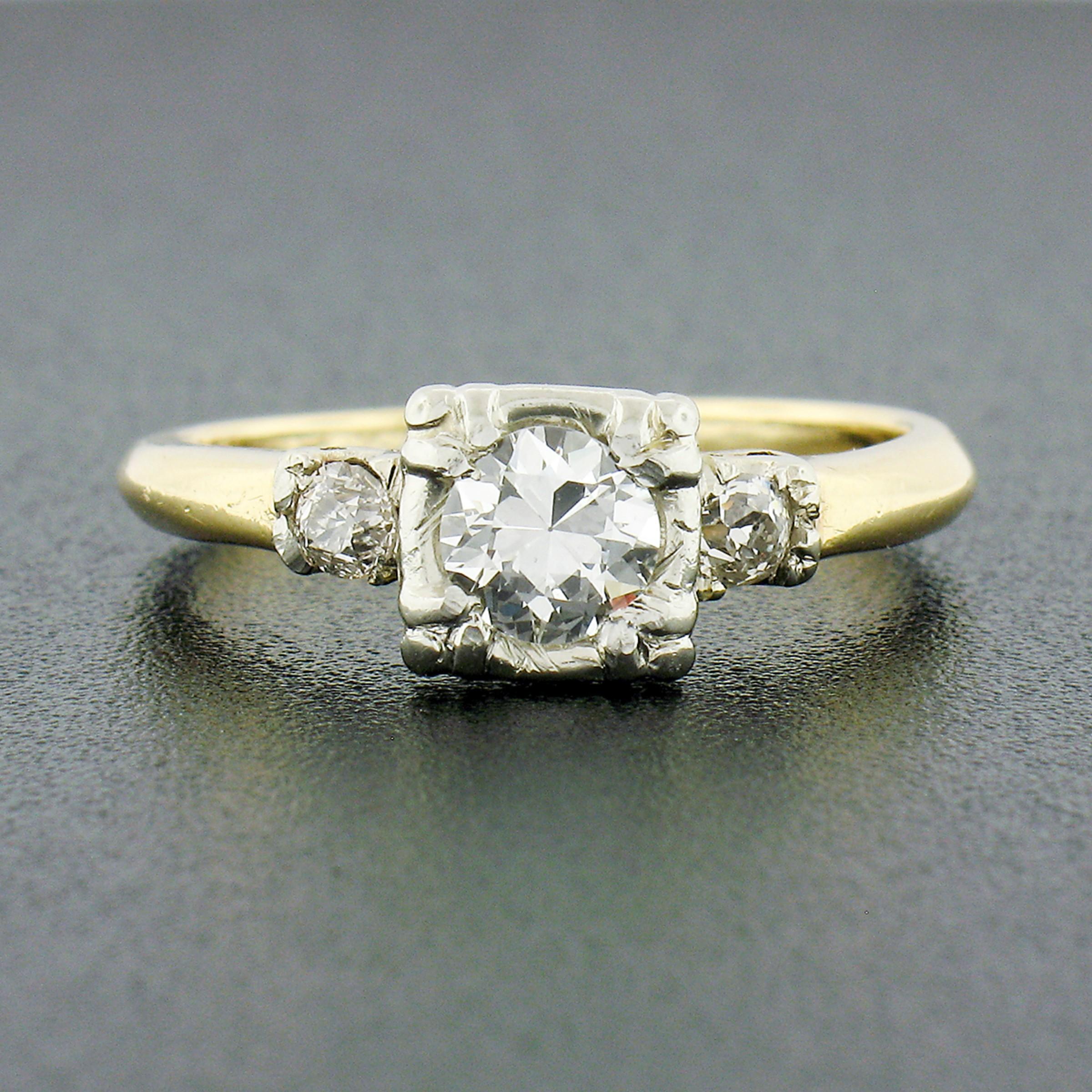 Here we have a gorgeous, vintage, diamond engagement ring that was crafted from solid 14k yellow and white gold. It features an old European cut diamond neatly set at the center, weighing approximately 1/2 carat, and displaying an amazing amount of