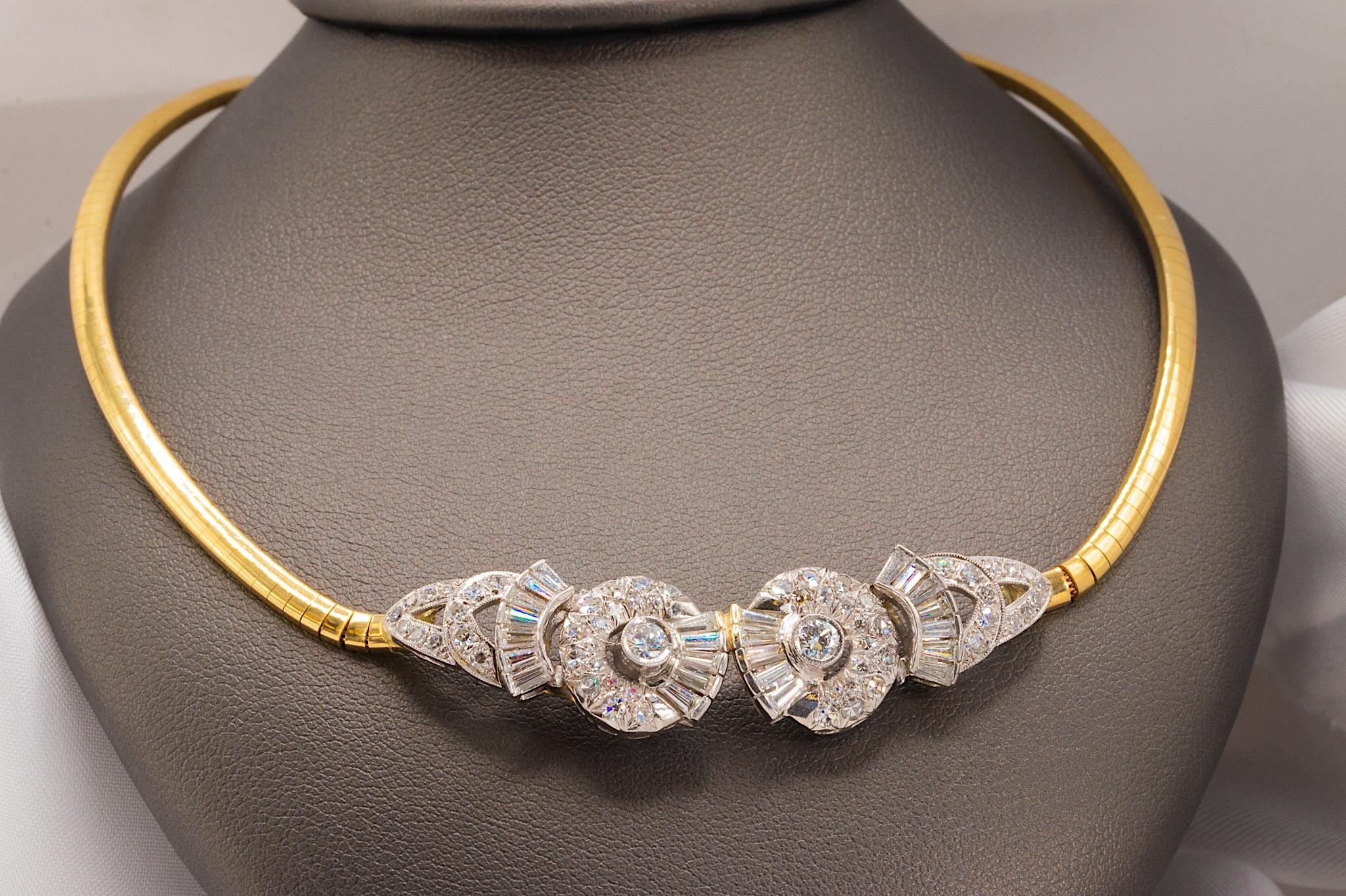 This necklace is unusual and show stopping, made up of a 14K yellow gold omega chain and a 14K white gold centerpiece of 84 crisp, white natural diamonds totaling an average of 2.42 carats. 

14K white gold stair-steps in the classic Art Deco style,