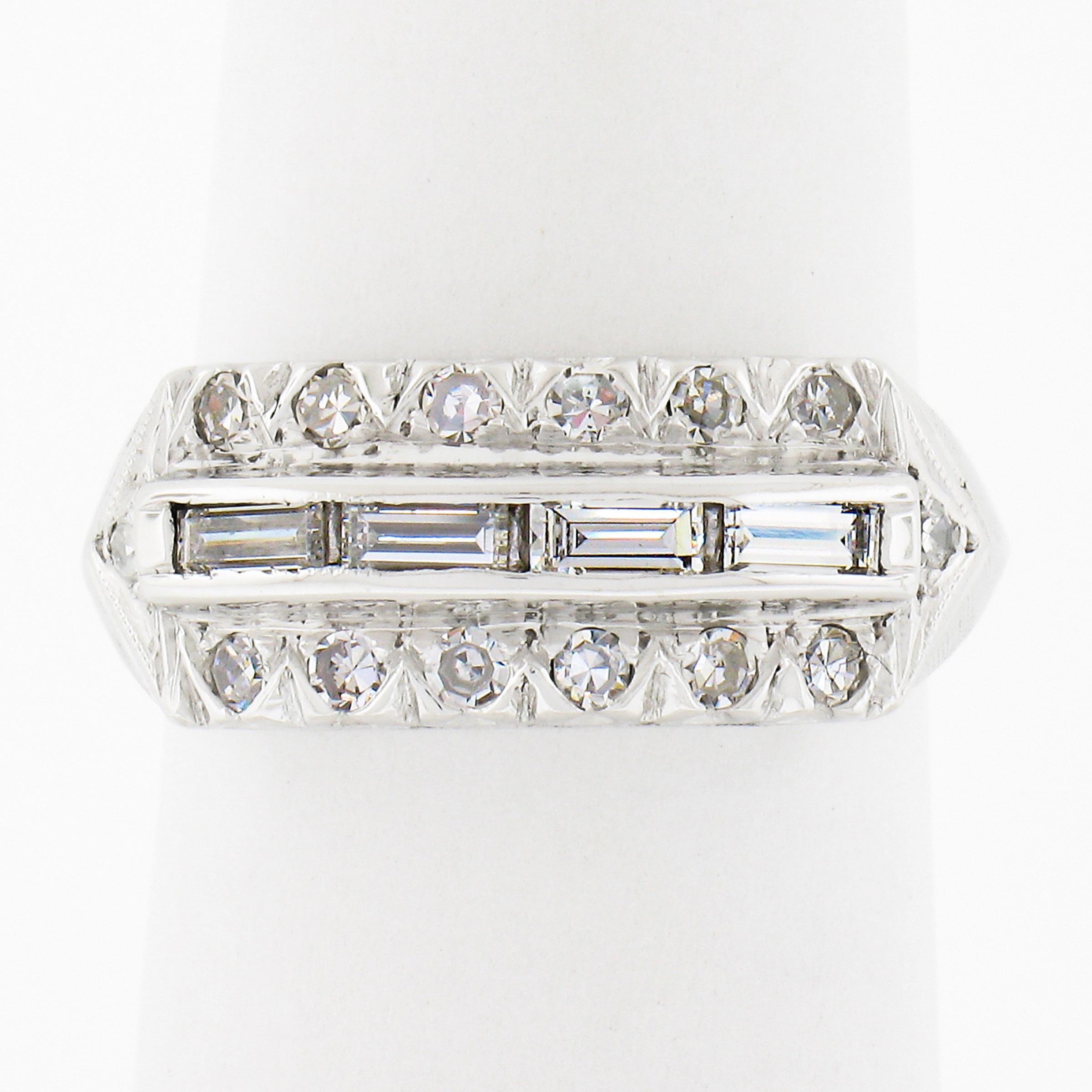 This here is an elegant vintage diamond band ring crafted in solid 14k white gold. The ring features approximately 0.42 carat of fine quality diamonds neatly set in three rows across its top. The center row features 4 straight baguette diamonds that