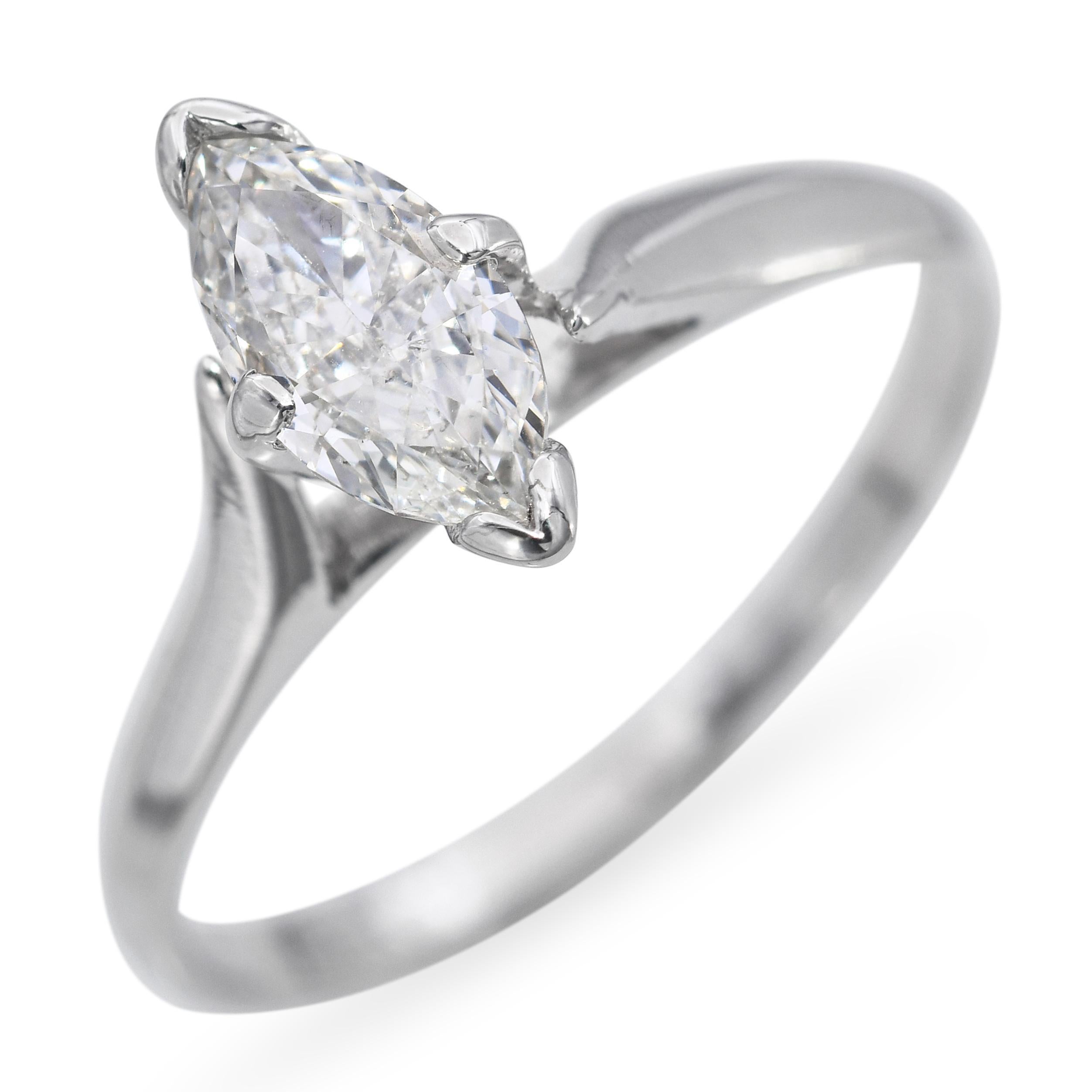 This vintage 14k white gold ring features a dazzling 0.70-carat marquise-cut diamond, graded SI1 clarity and J-K color, offering impressive brilliance and a flattering elongated shape. The marquise diamond is securely set to highlight its elegant