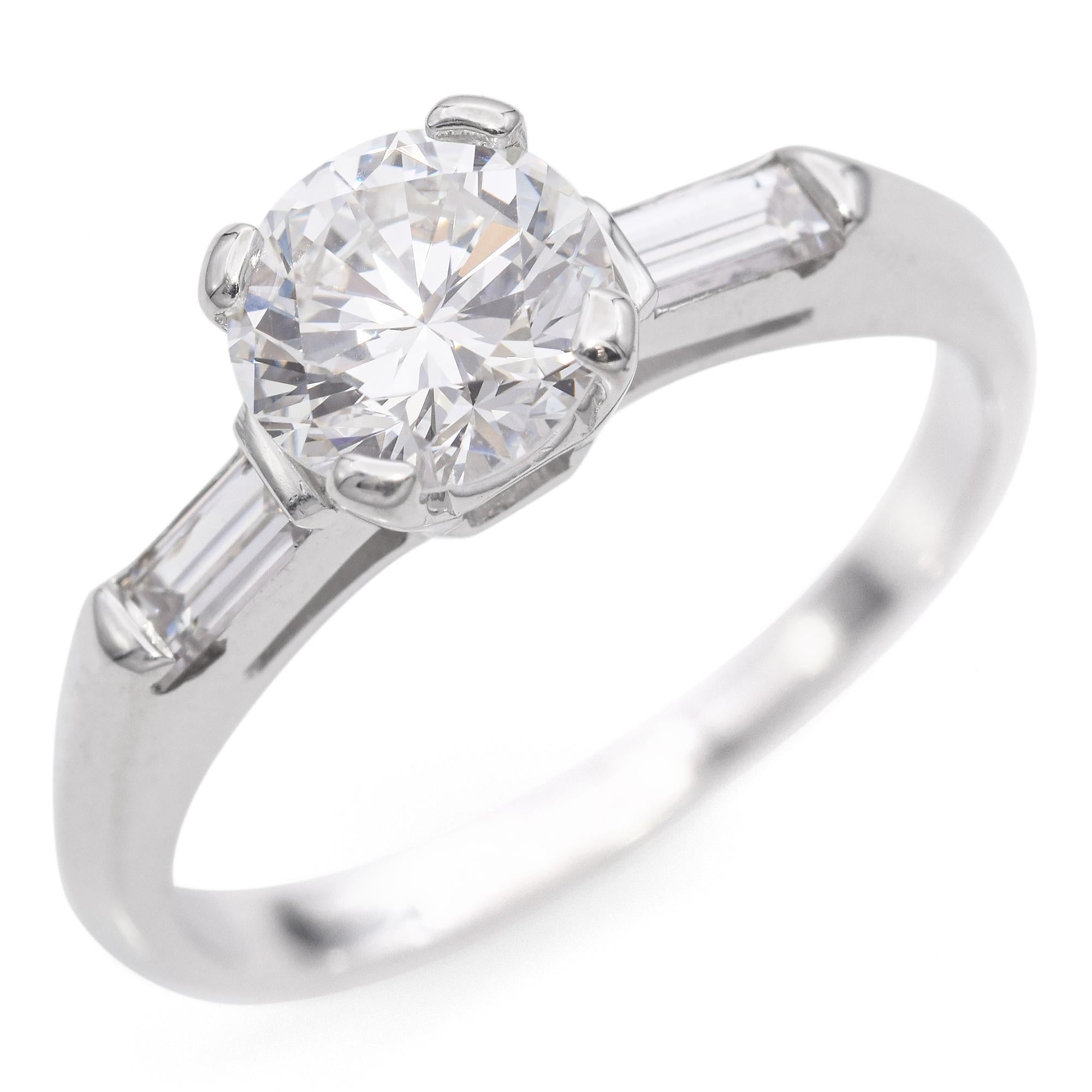 This elegant 14k gold engagement ring showcases a brilliant round cut diamond as its centerpiece. The diamond weighs 0.83 carats and boasts a stunning white color, held in place by a classic four-prong setting that enhances its sparkle.