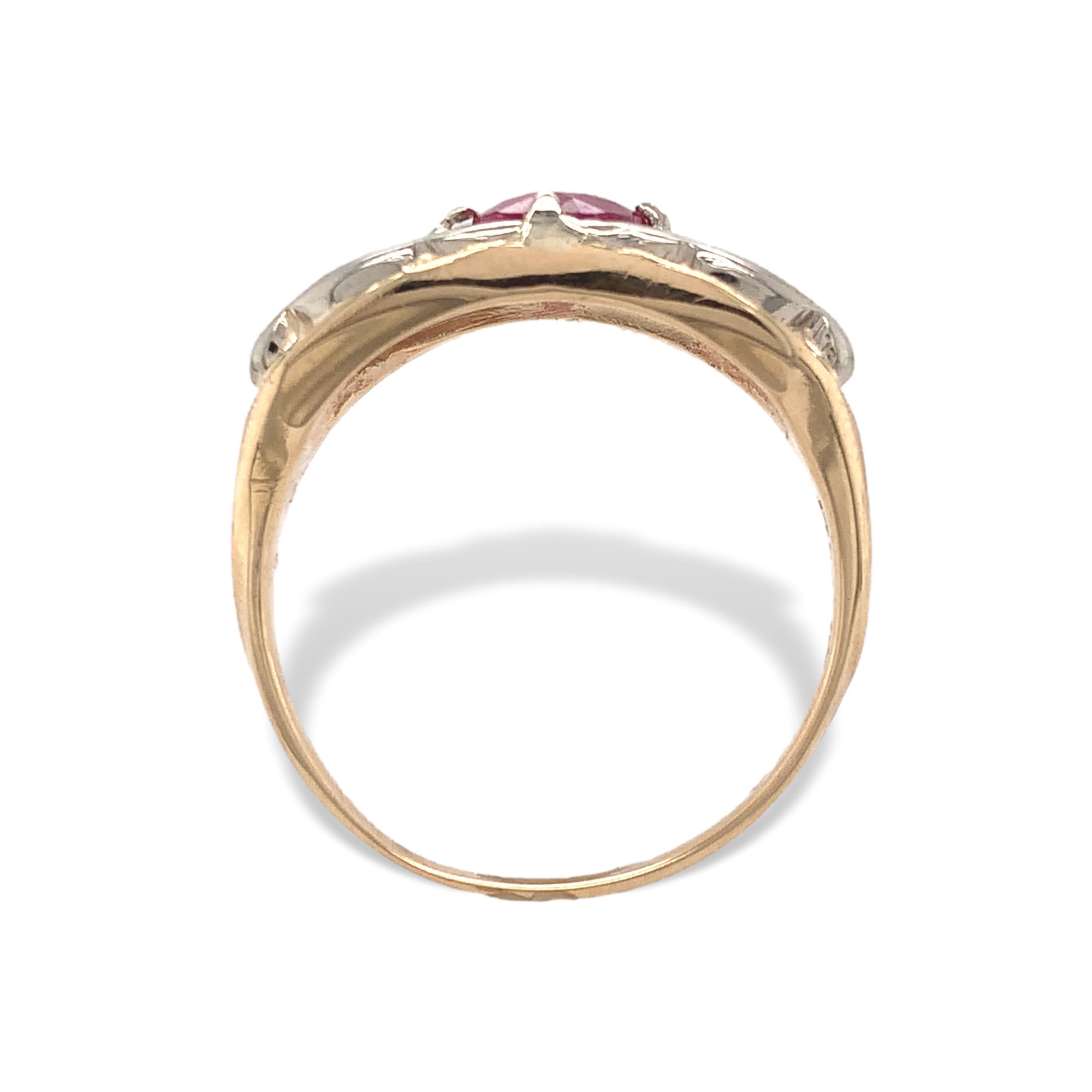 Vintage 14K yellow gold ruby ring. The ring features a genuine earth mined round pinkish-red ruby weighing .83cts. The ruby measures about 5.3mm. There are white gold leaves applied. The ring has 4 rebuilt prongs and fits a size 6.75 finger. It