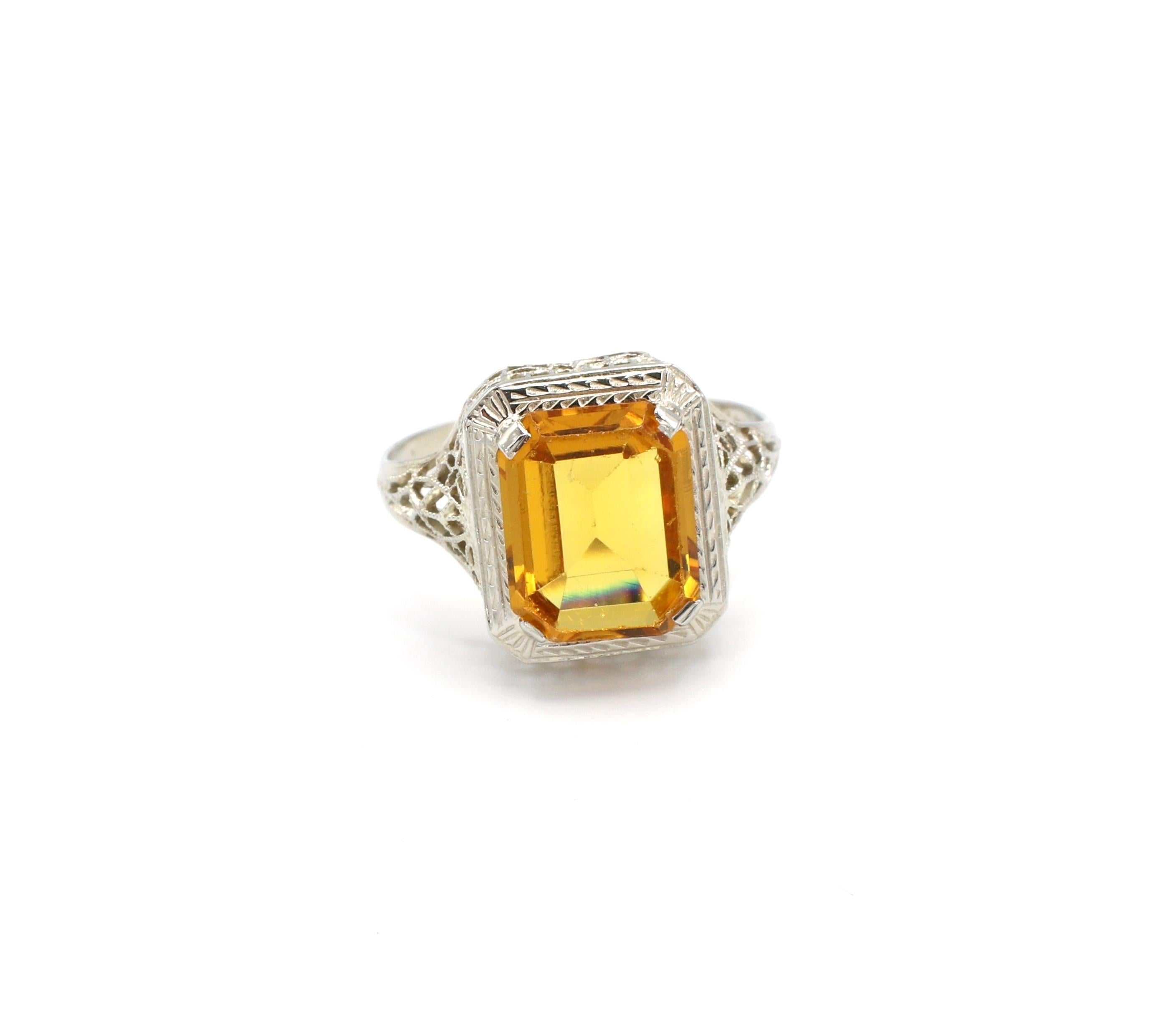 Vintage 14K White Gold Citrine Filigree Design Cocktail Ring Size 5.75

Metal: 14k white gold, marked 14k
Weight: 2.01 grams
Gemstone: 1 emerald cut citrine stone, 10.1mm x 8mm x 4.1mm, slight surface scratches
Band is 1.4mm at base
Size: 5.75 (US)
