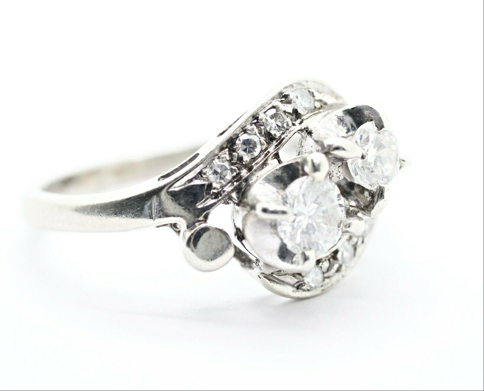  Specifications:
    main stone: ROUND DIAMONDS
    DIAMONDS: 10 PCS
    CARAT TOTAL WEIGHT: APPROXIMATELY 0.63 CTW
    color: H
    clarity: SI2
    brand: UNBRANDED
    metal: 14K WHITE GOLD
    type:  RING
    weight: 4.3 GRS 
    SIZE: 7.75US
  