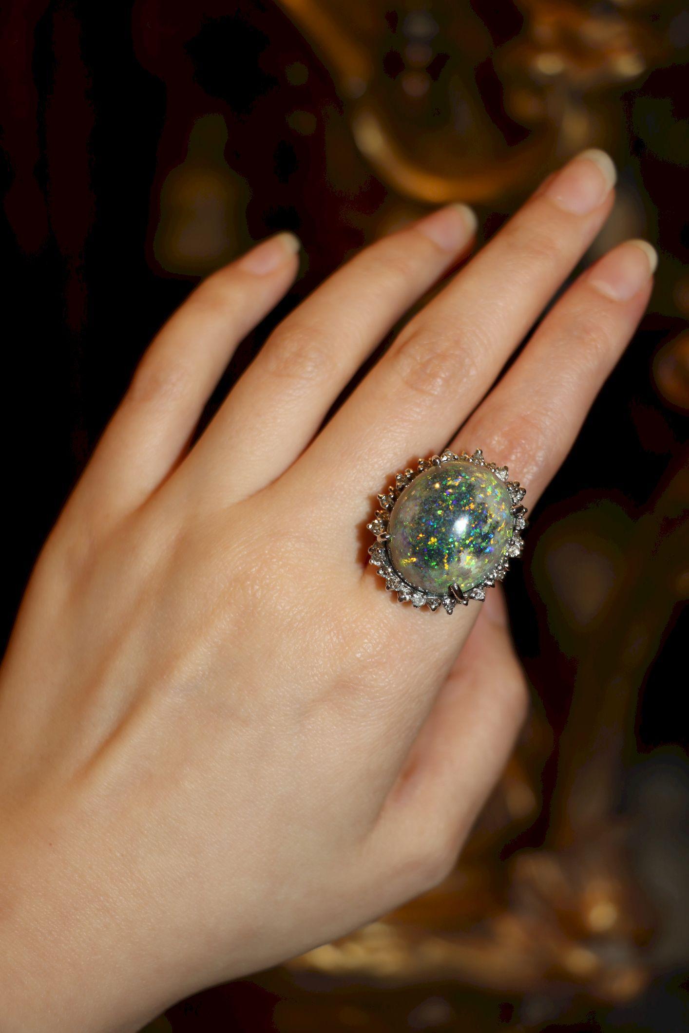14K White Gold Diamond Black Opal Cabochon Ring

Approximate Dimensions:
5.25 (Ring Size)
21.65 mm x 18.66 mm x (Opal)
Approx. 0.96 carats (Diamond)
13.6 grams in weights.

** All dimensions listed above are approximations based on our measurements
