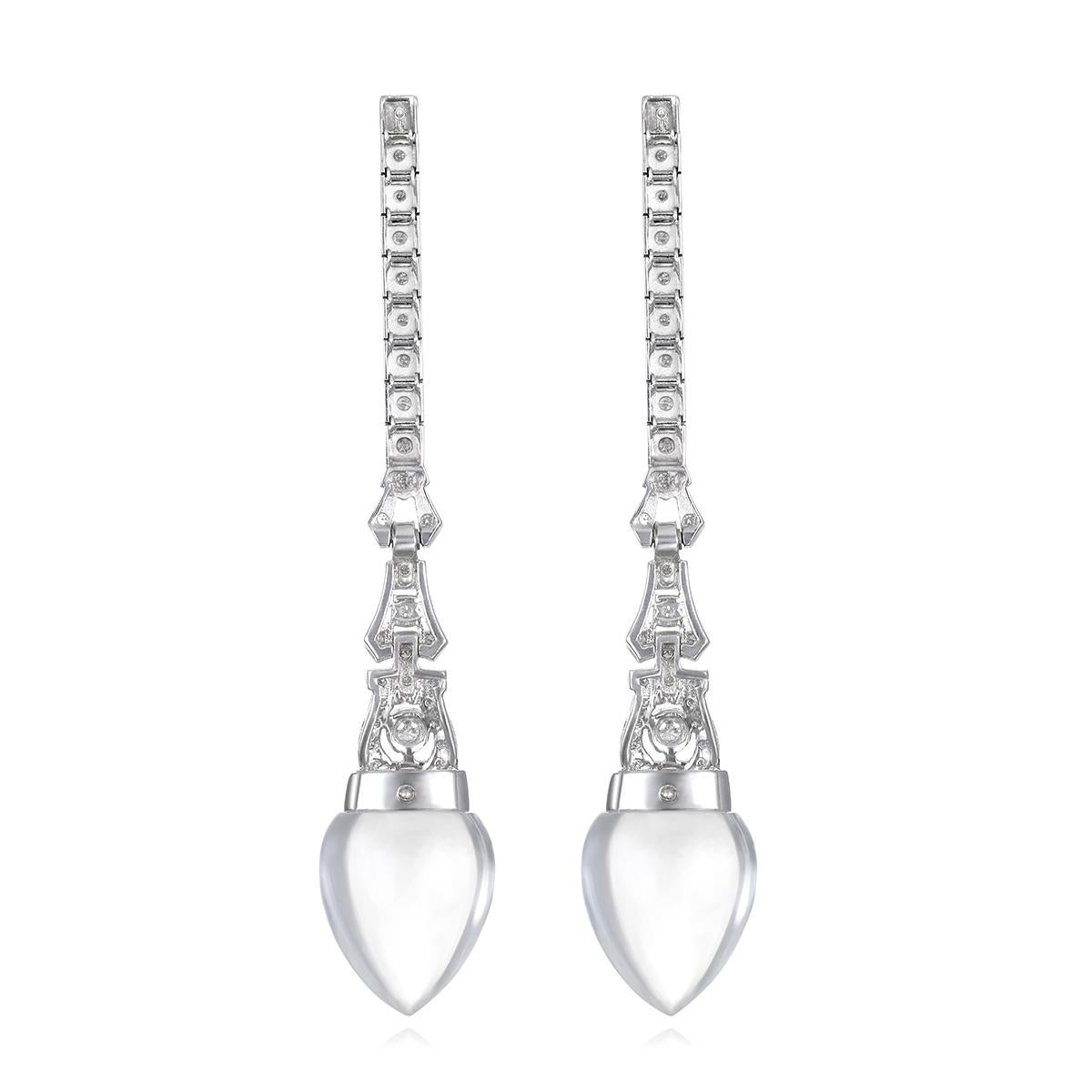 A Vintage watch in an Art Deco Style was reworked to make a pair of spectacular diamond line earrings. Set in 14 Karat White Gold, the diamond bracelet from a watch has been beautifully transformed with custom-cut Rock Crystal Quartz drops,