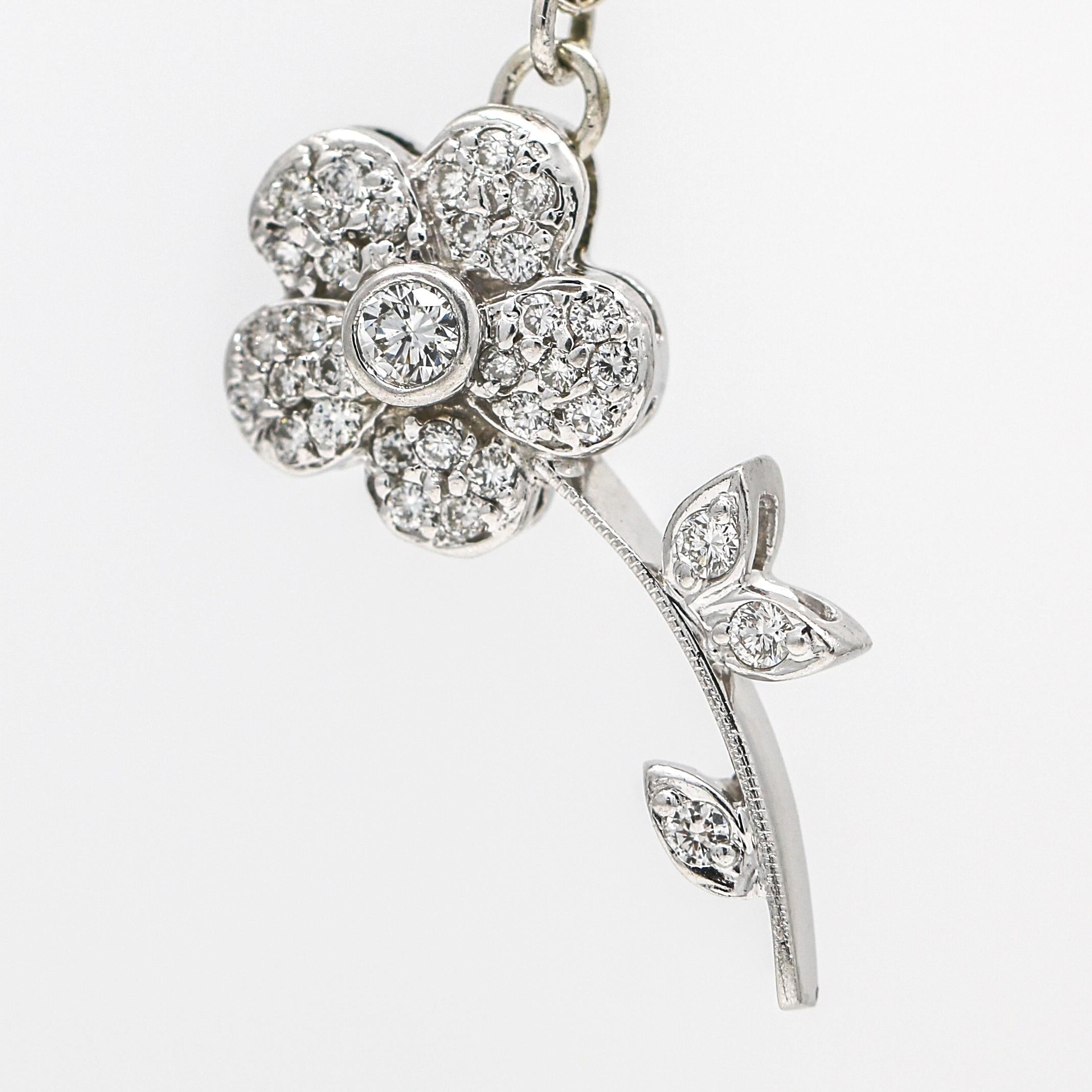 This exquisite Women's Diamond Flower Brooch has been transformed into a stunning pendant, making it an even more versatile piece of jewelry. The pendant features beautiful sparkling diamonds and signed BK.

Attached to the pendant is an Art Deco