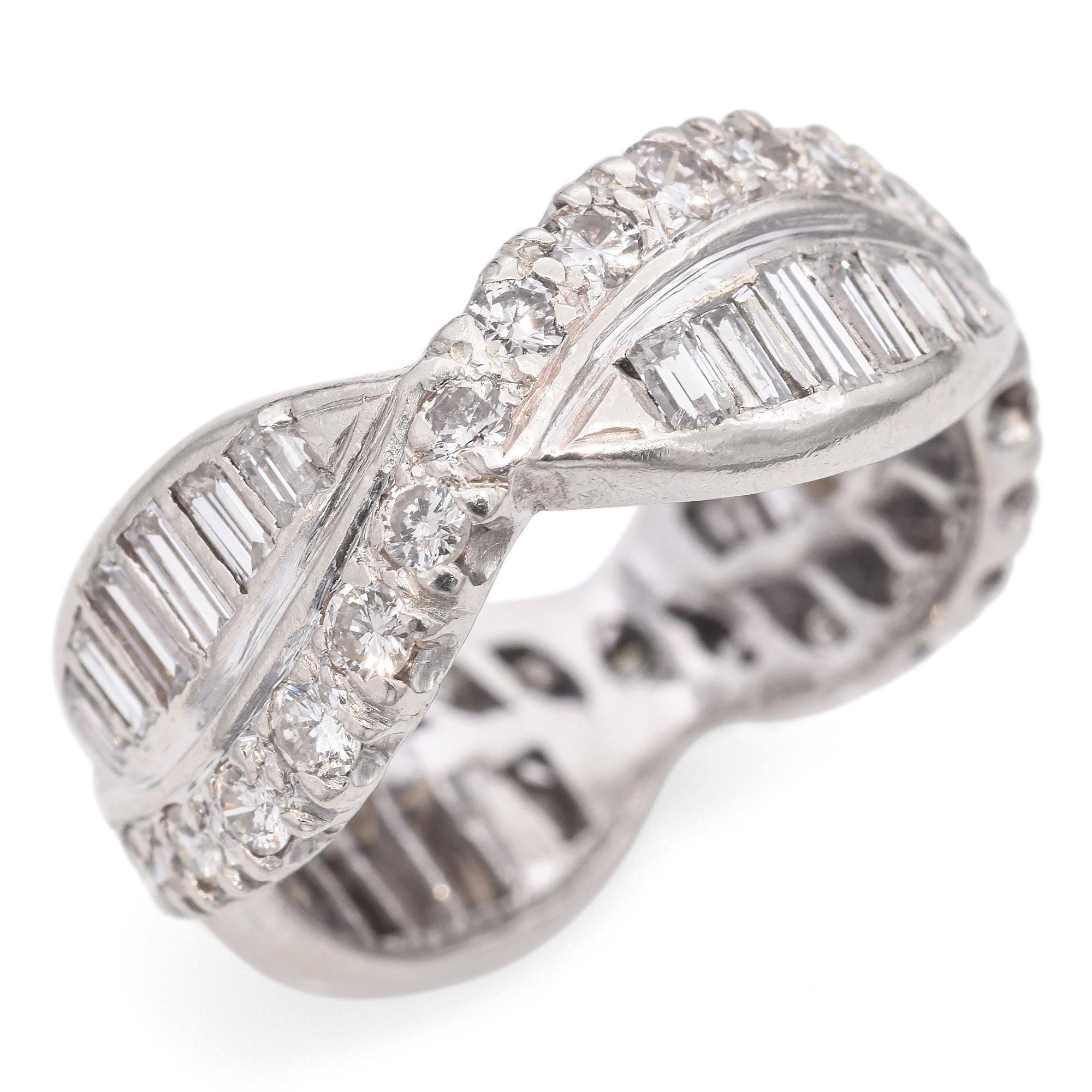 This elegant wedding ring is crafted in 14K white gold. It features a total of 1.24 carats of white diamonds, arranged in a sophisticated infinity design with both round and baguette cuts.

Weight: 5 Grams
Stone: 1.24tcw Diamond
Measurements: 20 x