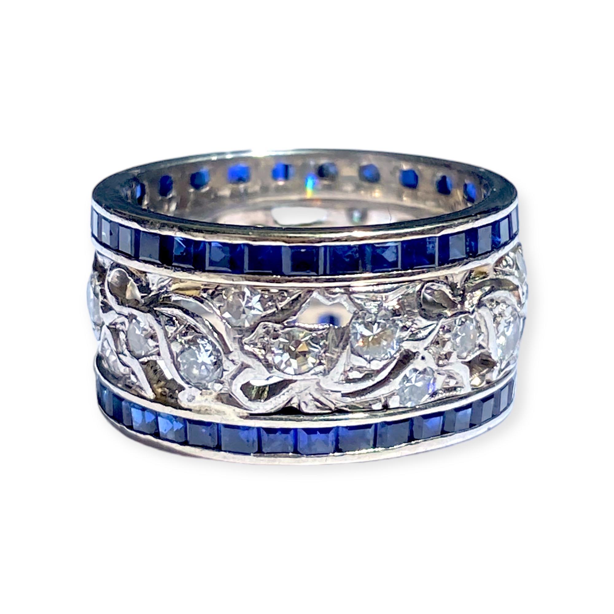 Vintage 14K white gold the ring featuring a diamond eternity band in the center with a synthetic sapphire eternity band attached on each side. 
30 round diamonds: 0.90ctw. Color: H-I, Clarity: SI1-I1
Measurements:
Width: 10.5 mm
Weight: 6.7