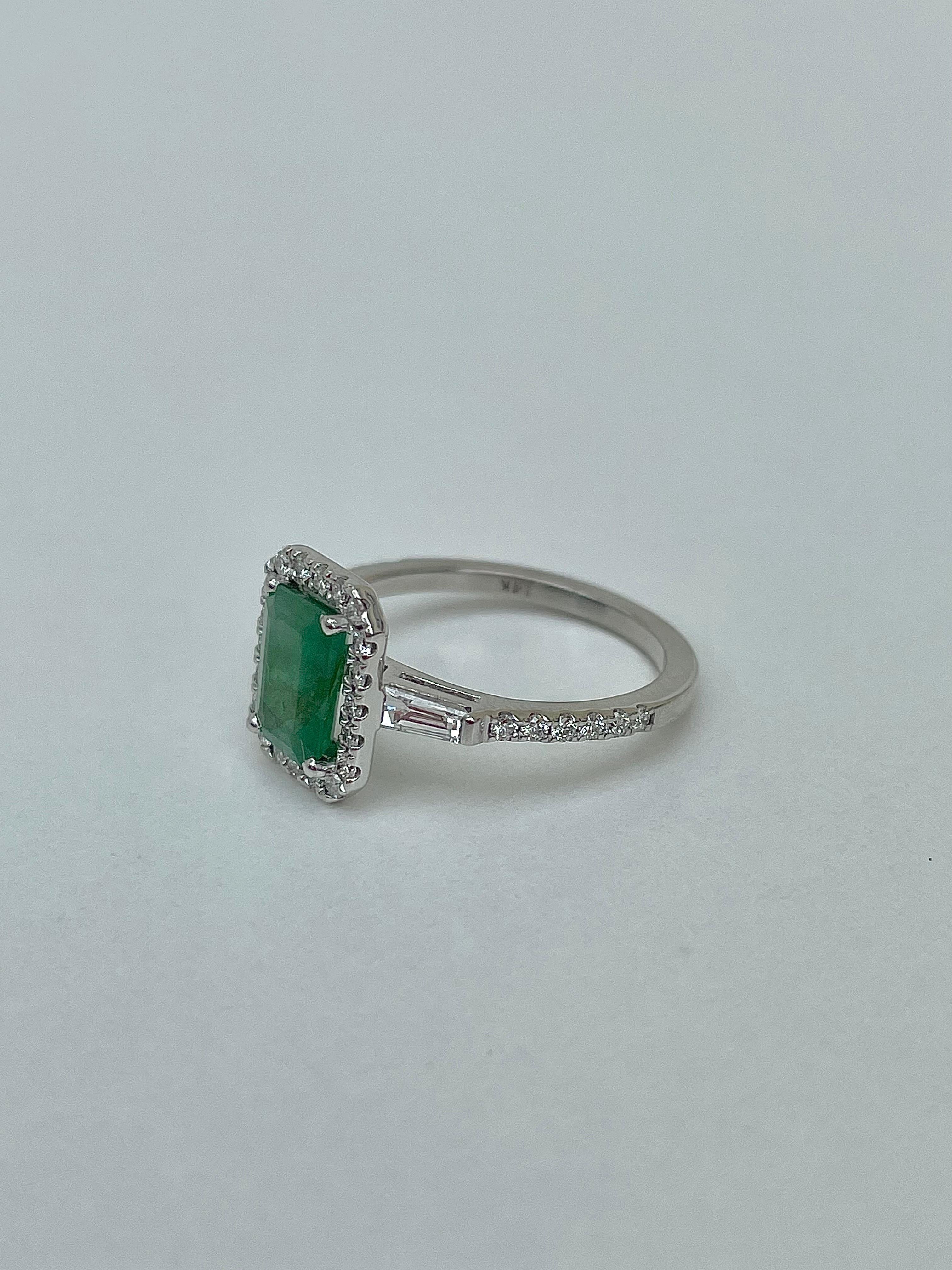 Delightful Emerald and Diamond halo ring with lovely baguette cut diamond shoulders set entirely in  14K White Gold.



darling emerald and diamond halo ring, she sparkles in the sunlight!



The item comes without the box in the photos but will be
