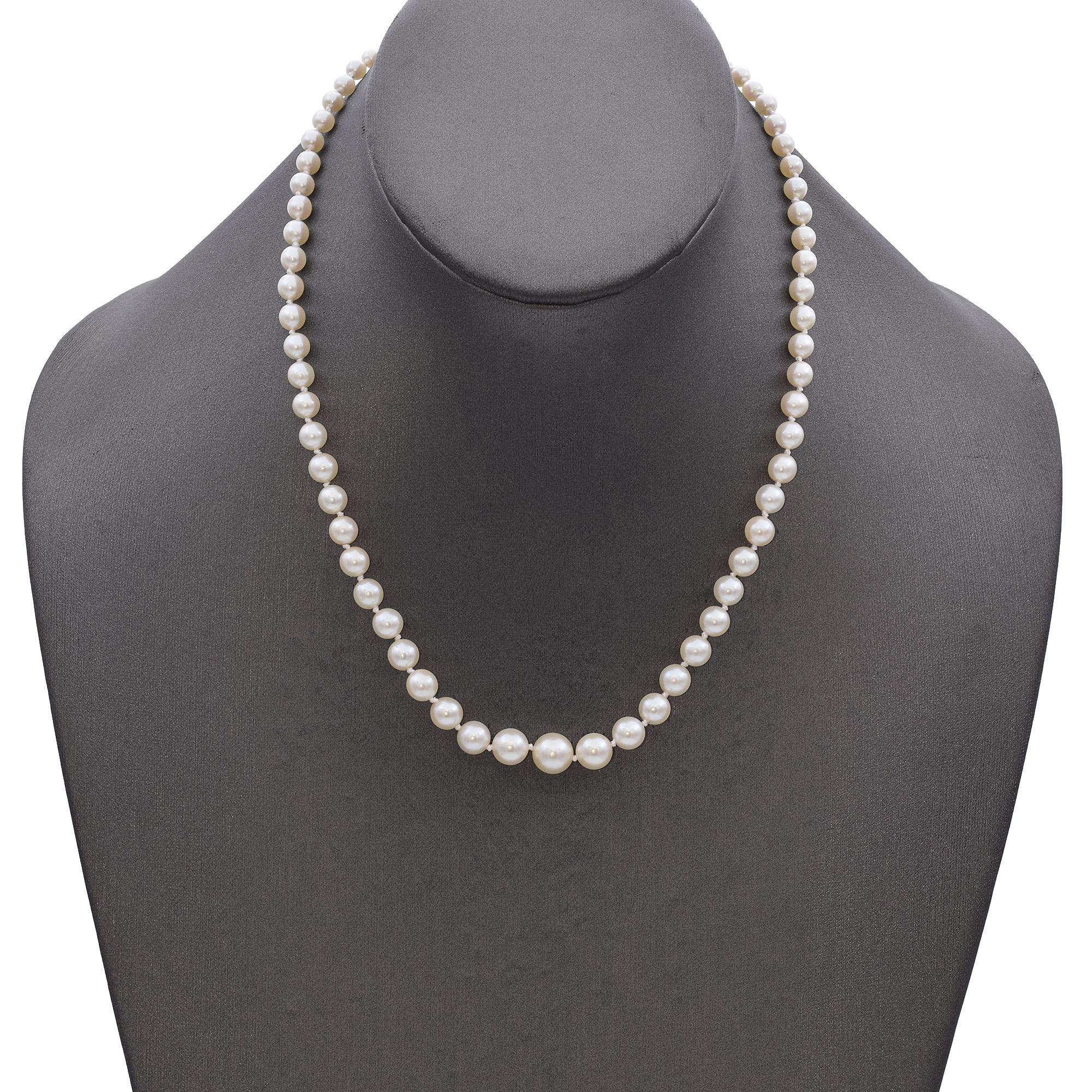 This elegantly crafted beaded necklace features lustrous pearls, radiating timeless beauty and sophistication.
The necklace is secured with an intricately designed 14k gold clasp, adding a touch of artistry and elegance to this classic piece.