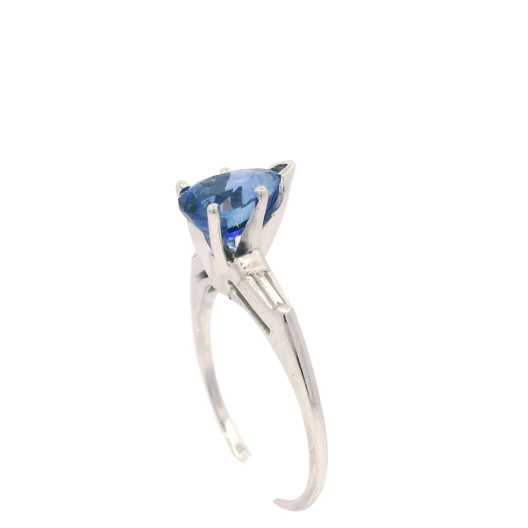 --Stone(s):--
(1) Natural Genuine Sapphire - Pear Cut - Prong Set - Royal Blue Color - Heated - 1.56ct (exact - certified)
*See Certification Details Below*
(2) Natural Genuine Diamonds -  Baguette Cut - Channel Set - White Color - 0.06ctw
