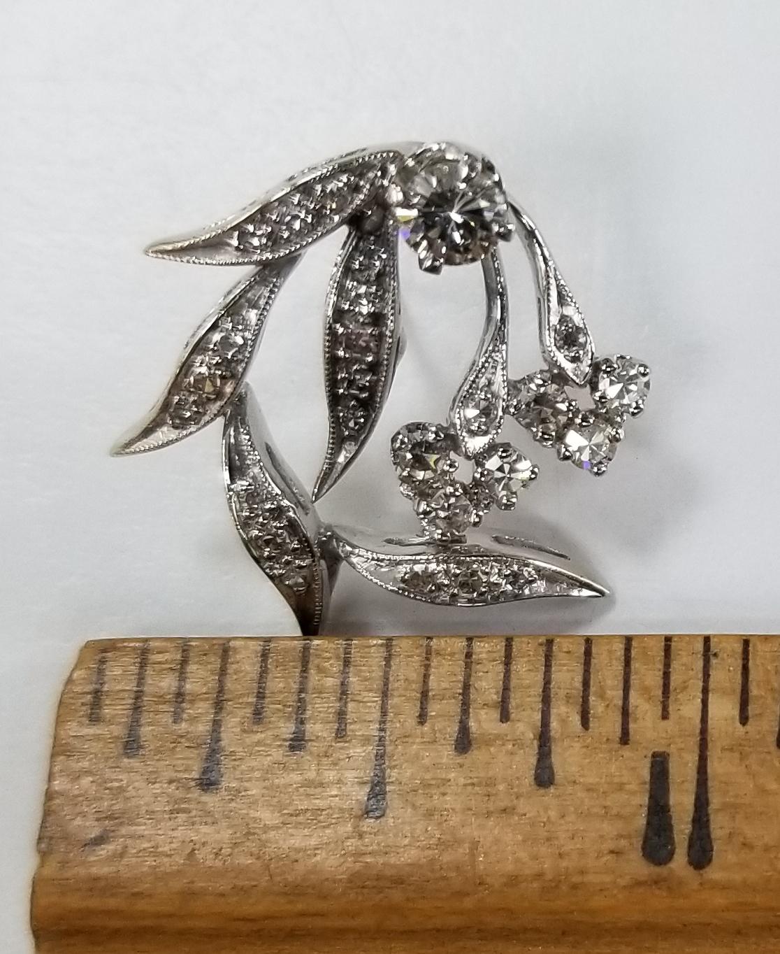 Vintage 14k white gold leaf diamond earrings, containing 54 round diamonds of both single and full cut; color 