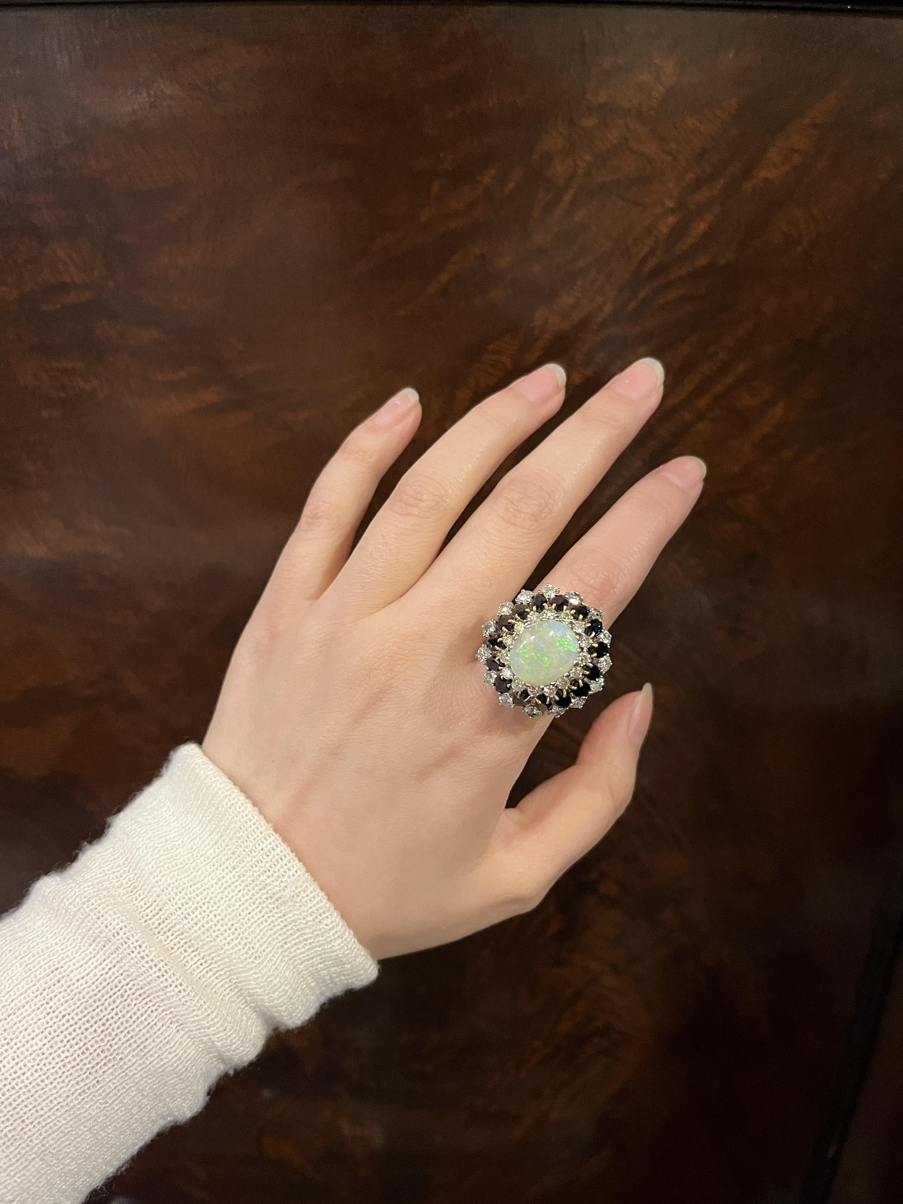 Vintage 14K White Gold Opal Sapphire Diamond Ring

Marked:
14K

Approximate Dimensions:
6.25 (Ring Size)
3.5 Carats (+/- Diamond)
1.6 Carats (+/- Sapphire)
13.51 mm x 11.02 mm (Opal)
13.8 grams in weight.