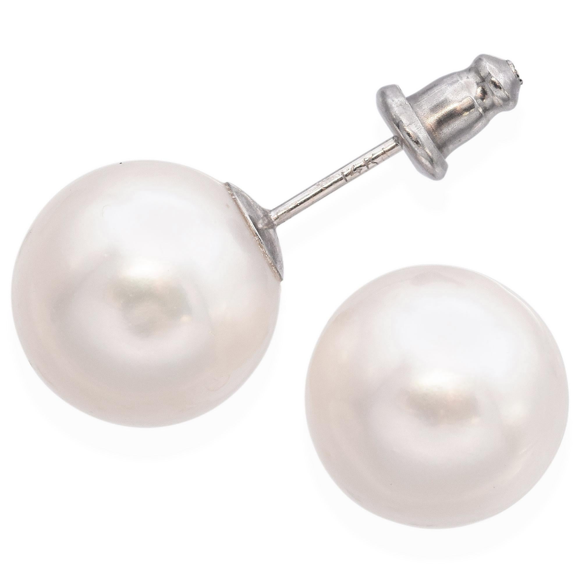 14K Gold Pearl Stud Earrings featuring lustrous pearls set in 14k gold. The earrings showcase a timeless design.

Weight: 4.4 Grams 
Stone: Pearl (11.25mm)
Measurements: 12 x 11.5 x 11.85mm
Metal: 14k Gold (Backings: Stainless Steel)

Item #: