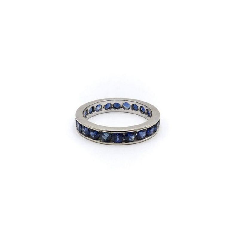 This beautiful 14k white gold eternity band features 22 well-saturated natural blue sapphires. The richness of the blue hues vary slightly from stone to stone creating a sparkling sea of blue in the channel setting of the ring.

There are 22