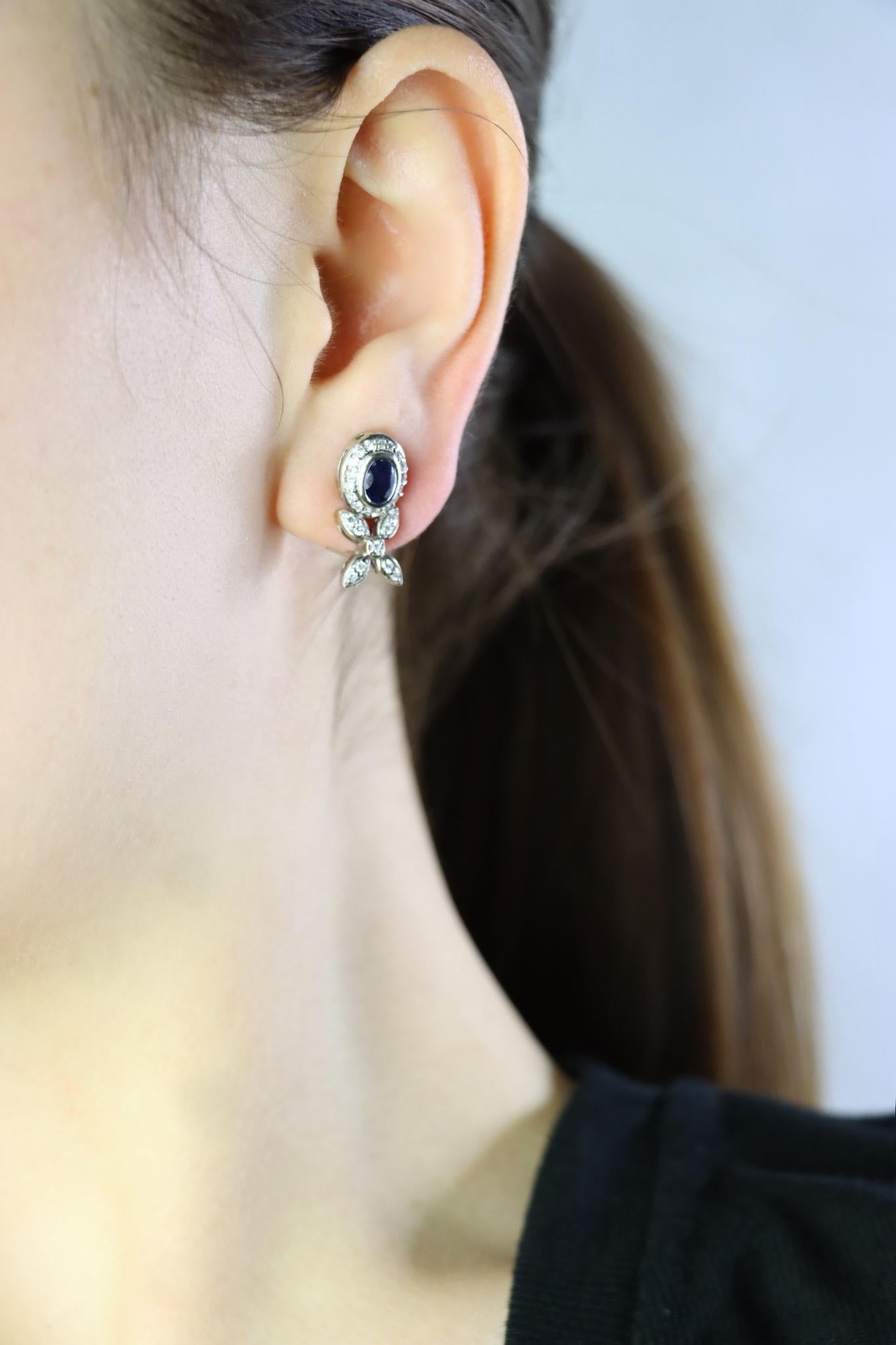 Vintage 14K White Sapphire Diamond Earrings

Approximate Dimensions:
2 cm (Length) 
0.8 cm (Width ) 
Approx. 0.5 carat (Diamond)
Approx. 0.5 carat (Sapphire)
6.0 grams in weight

** All dimensions listed above are approximations based on our